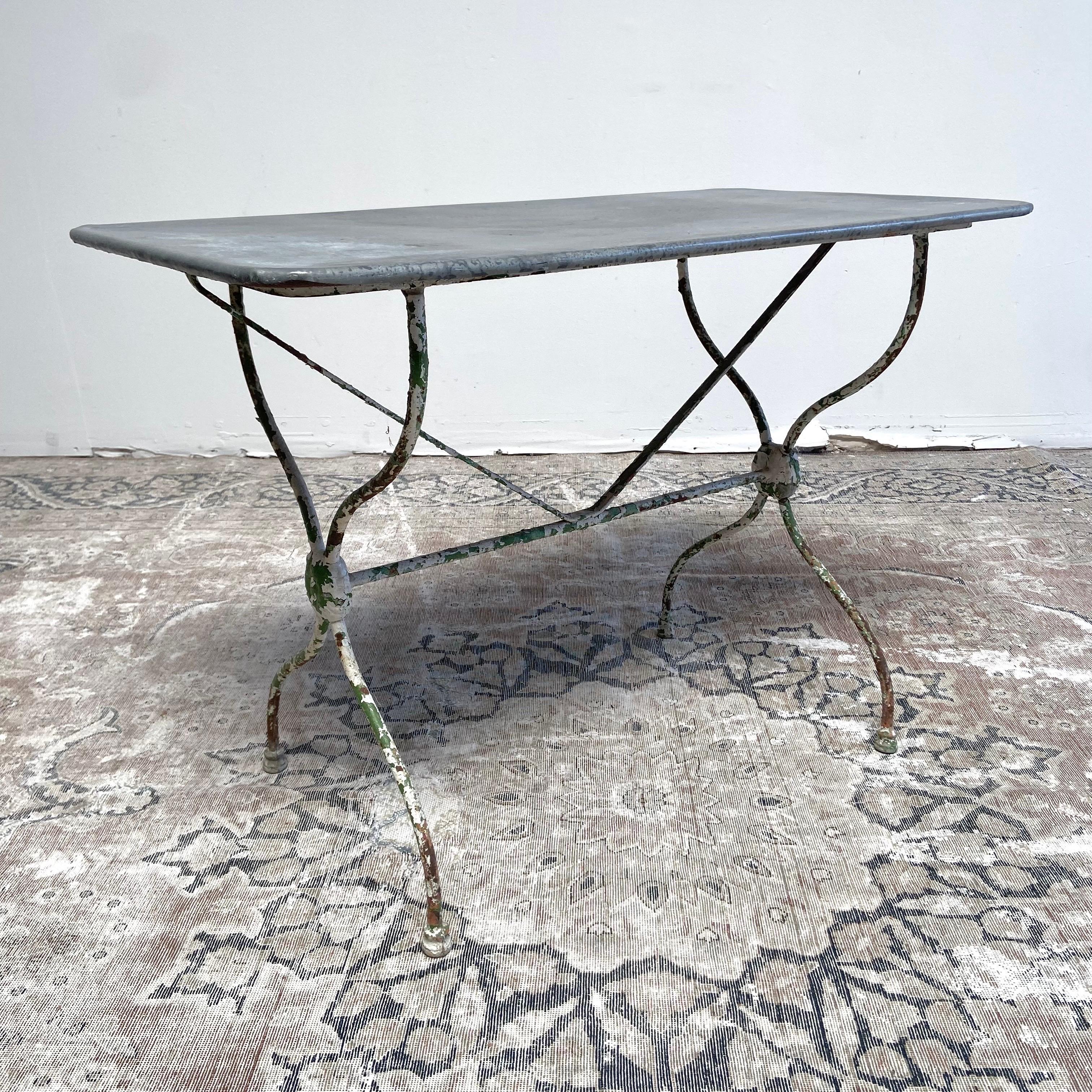 Antique potting tables in good condition are very difficult to source, particularly ones in zinc with lovely patinas. 
Fully functional, they also work as serving or display tables for inside or out. 
French zinc table 38-1/2” W x 20-1/2” D x 27”
