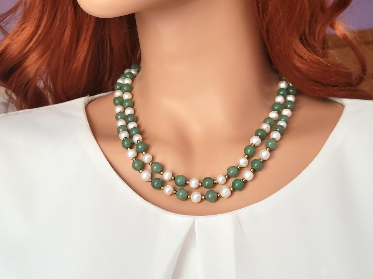This beautiful, elegant, classic, long necklace is made of natural freshwater pearls and natural green jade. The jade beads are pure, uniform, soft green, mint color, and delicate shiny, and they're sumptuous in how they look and feel.
The vintage