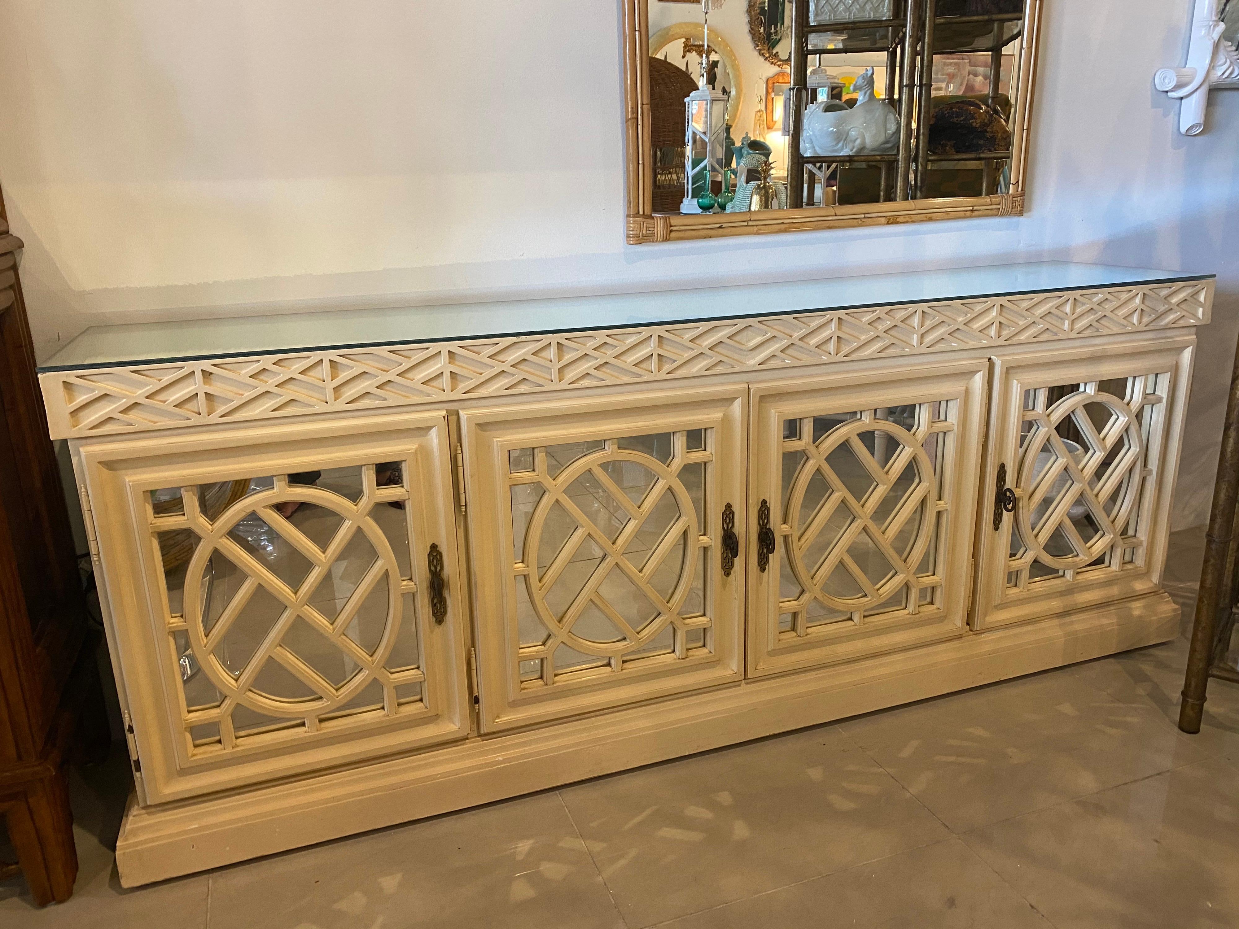 Vintage fretwork Chinese Chippendale mirrored credenza, cabinet, buffet, dresser. Removable mirror top. Doors open to reveal shelves and drawers (see pictures). This is in its original vintage finish so it will need paint, lacquer or re finishing as