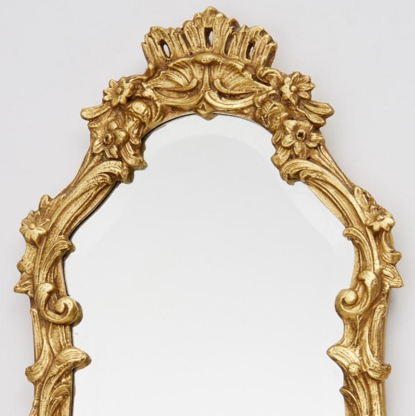 20th c., crown topped with a scrolled flower frame design and beveled glass, Friedman Brothers sticker label verso. From the Signature Collection this mirror, the Alexis #6139, is charming and the design lends itself to multiple applications. I