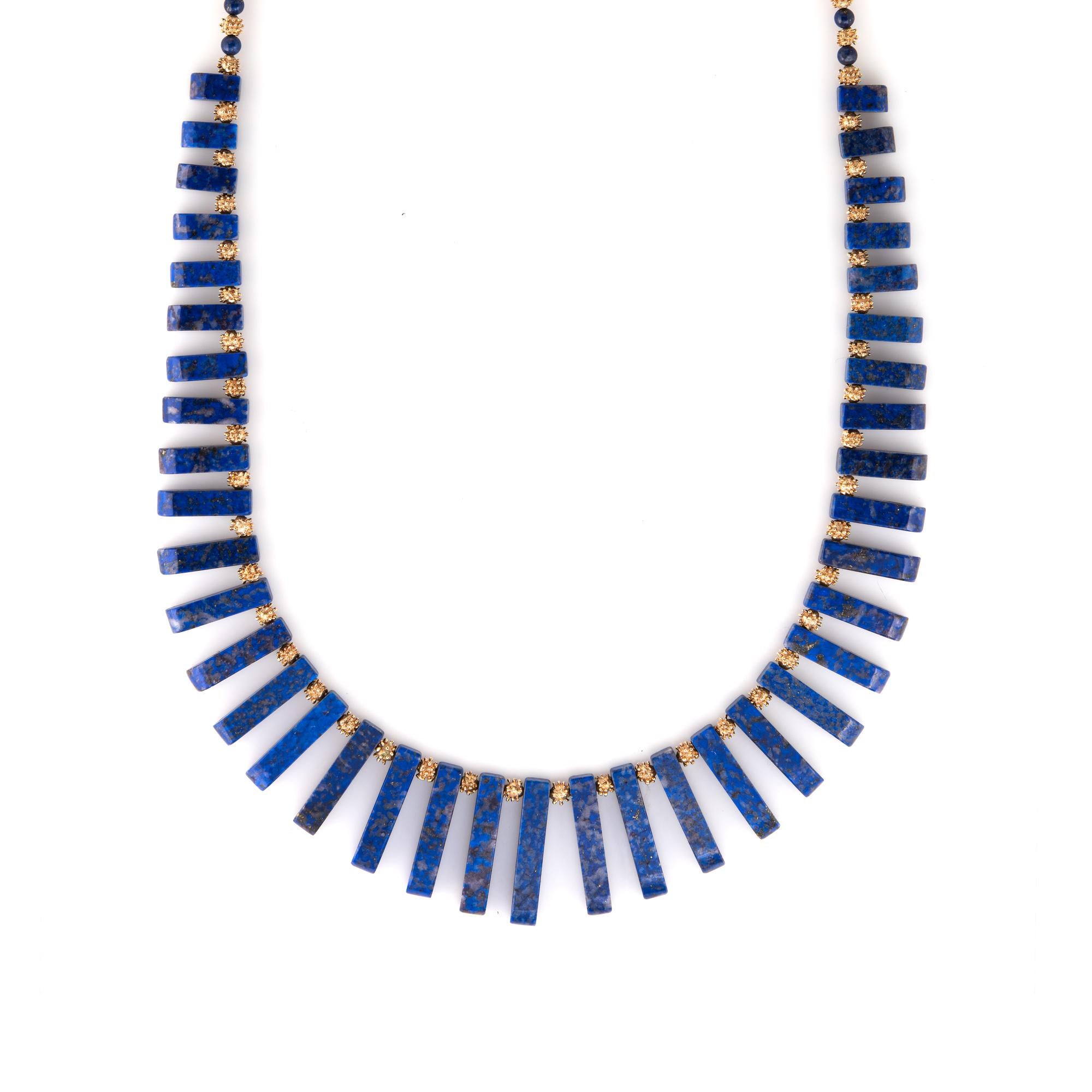 Finely detailed vintage lapis lazuli fringe necklace crafted in 14 karat yellow gold. 

Lapis lazuli tendrils graduate in size from 10mm to 28mm along with 4mm lapis lazuli beads. The stones are in excellent condition and free of cracks or