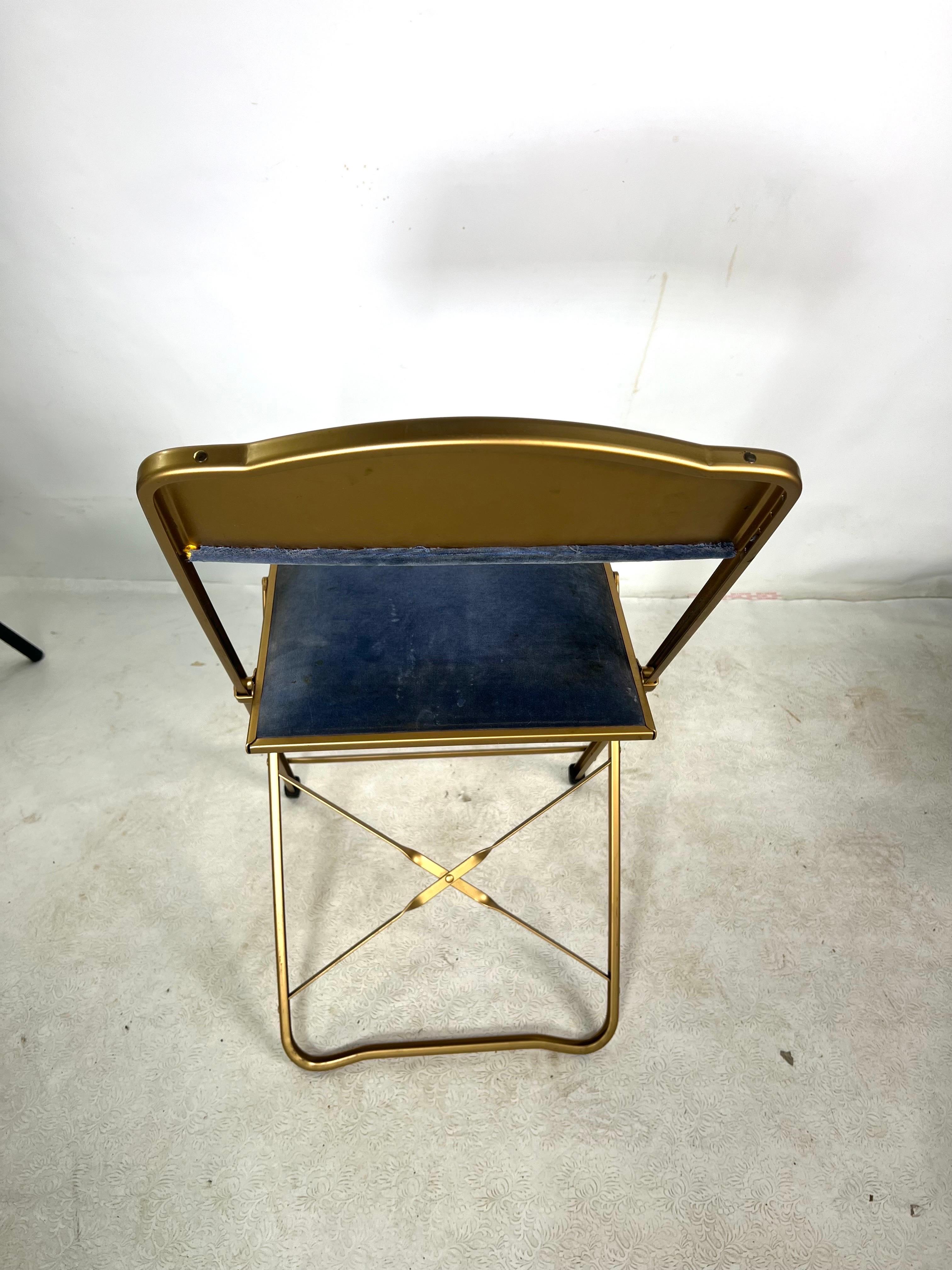 For sale is this nice vintage velvet folding chair, made by Fritz Chair & Co. We currently have 15 chairs available for purchase. Each chair is 95.00.