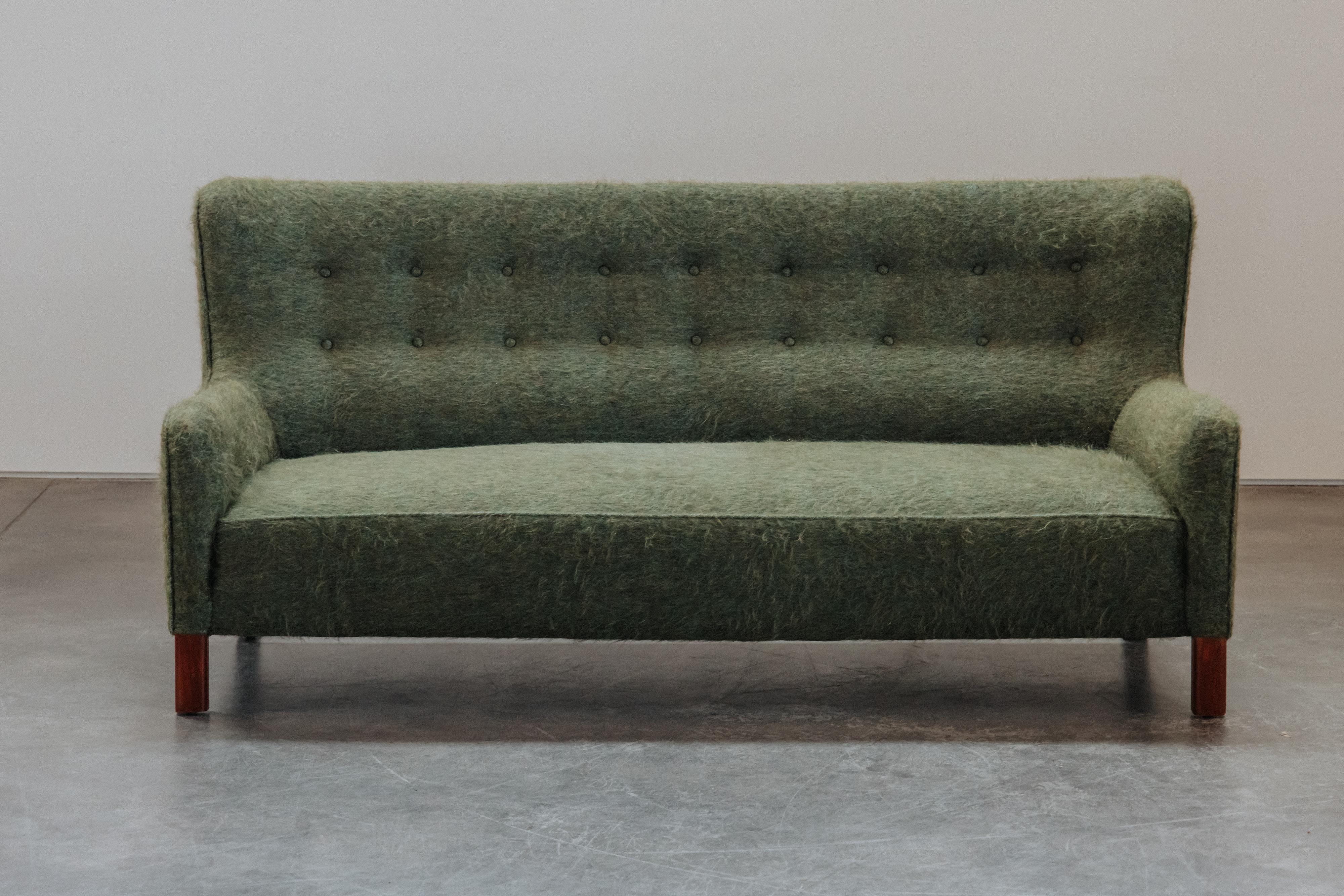 Vintage Fritz Hansen Sofa From Denmark, Circa 1950.  Early model, later reupholstered in Denmark.  Excellent condition.