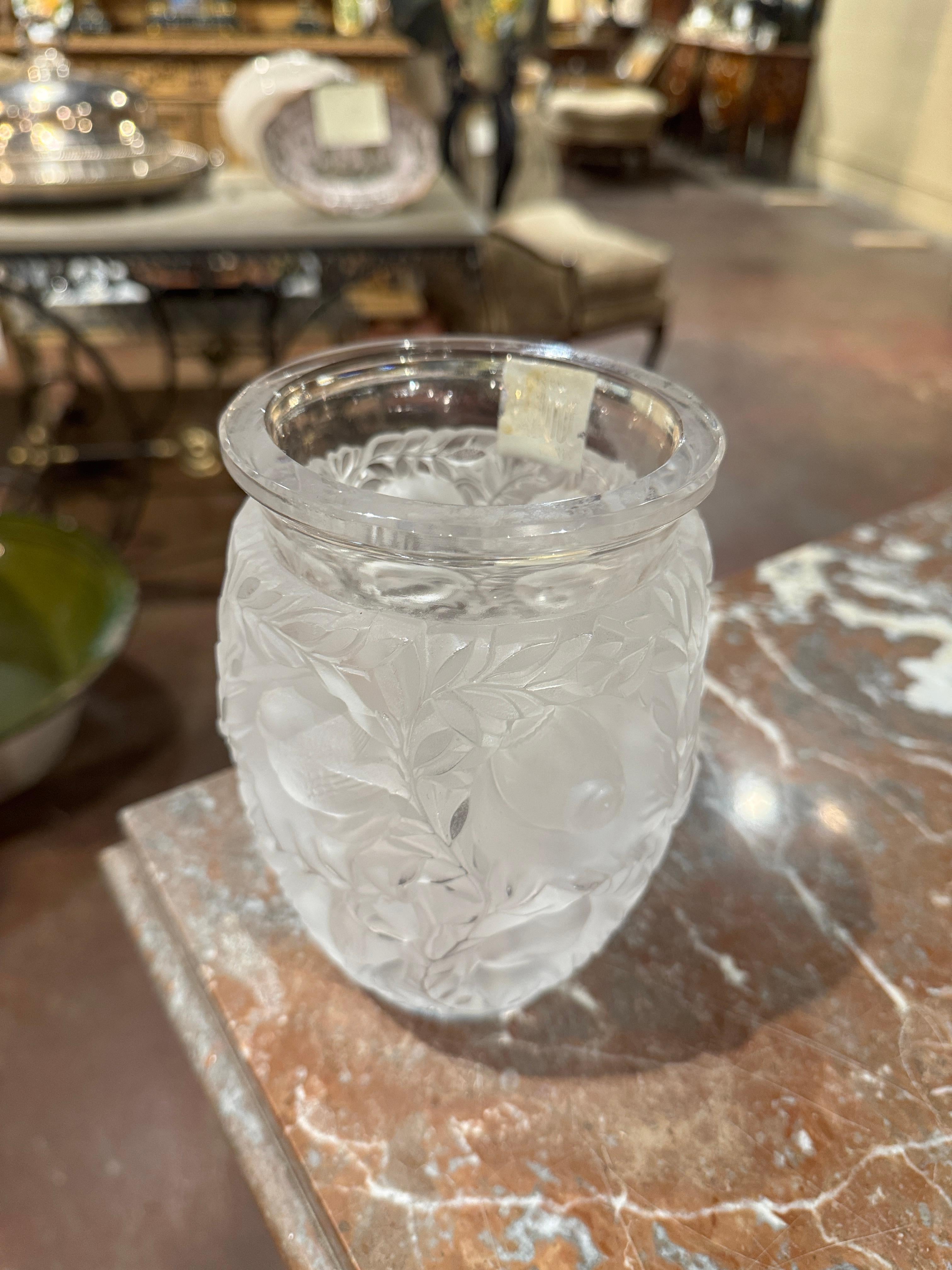 This exquisite Bagatelle vase by Lalique France is a celebrated example of the Maison’s elegant Art Deco-inspired crystal work. Designed with remarkable artistry, the vase features an all-over relief of small birds in flight and nestled among