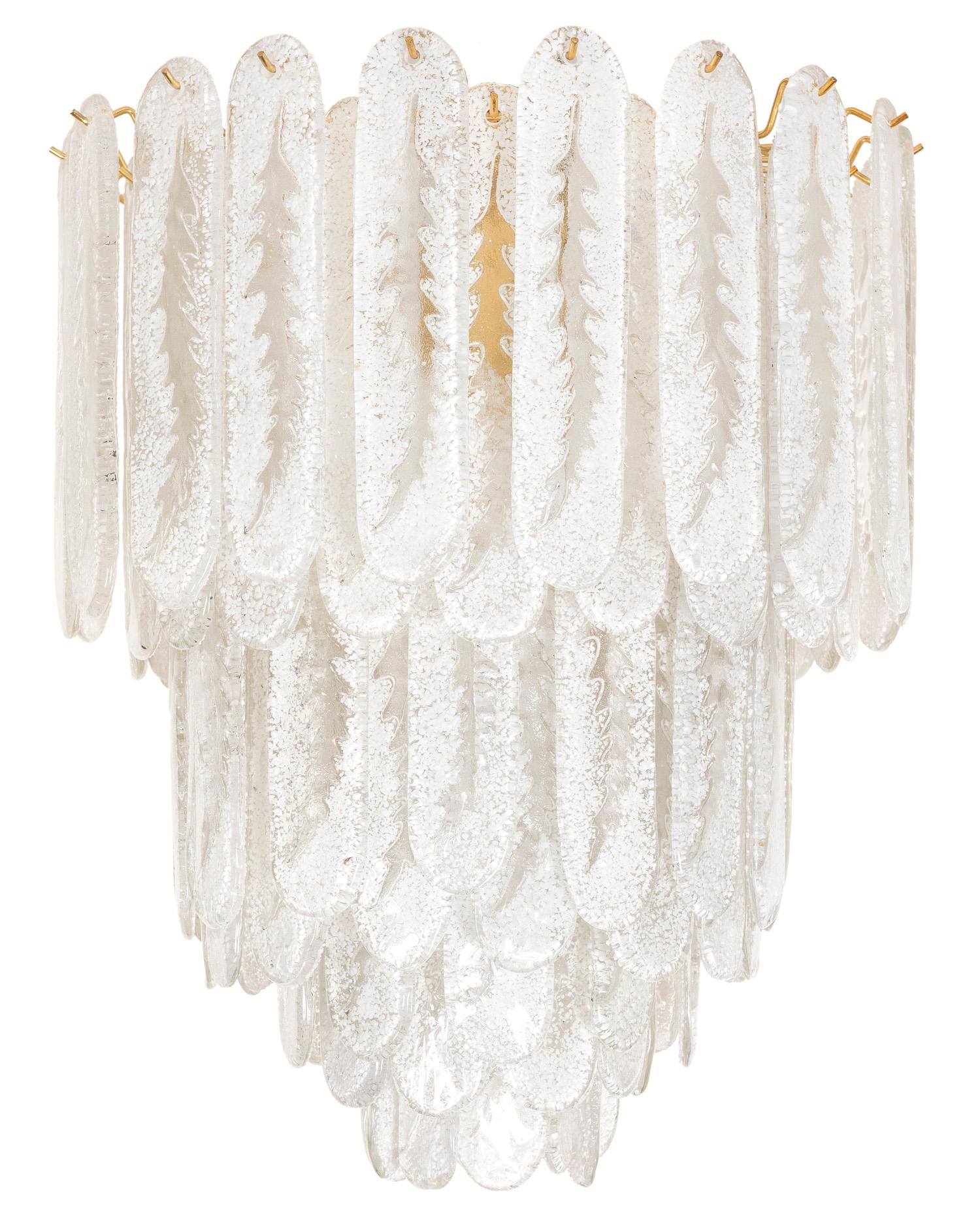 This dazzling multi layered Murano light is adorned with rounded rectangular frosted glass surrounding a brass interior frame. It is wired for North America.