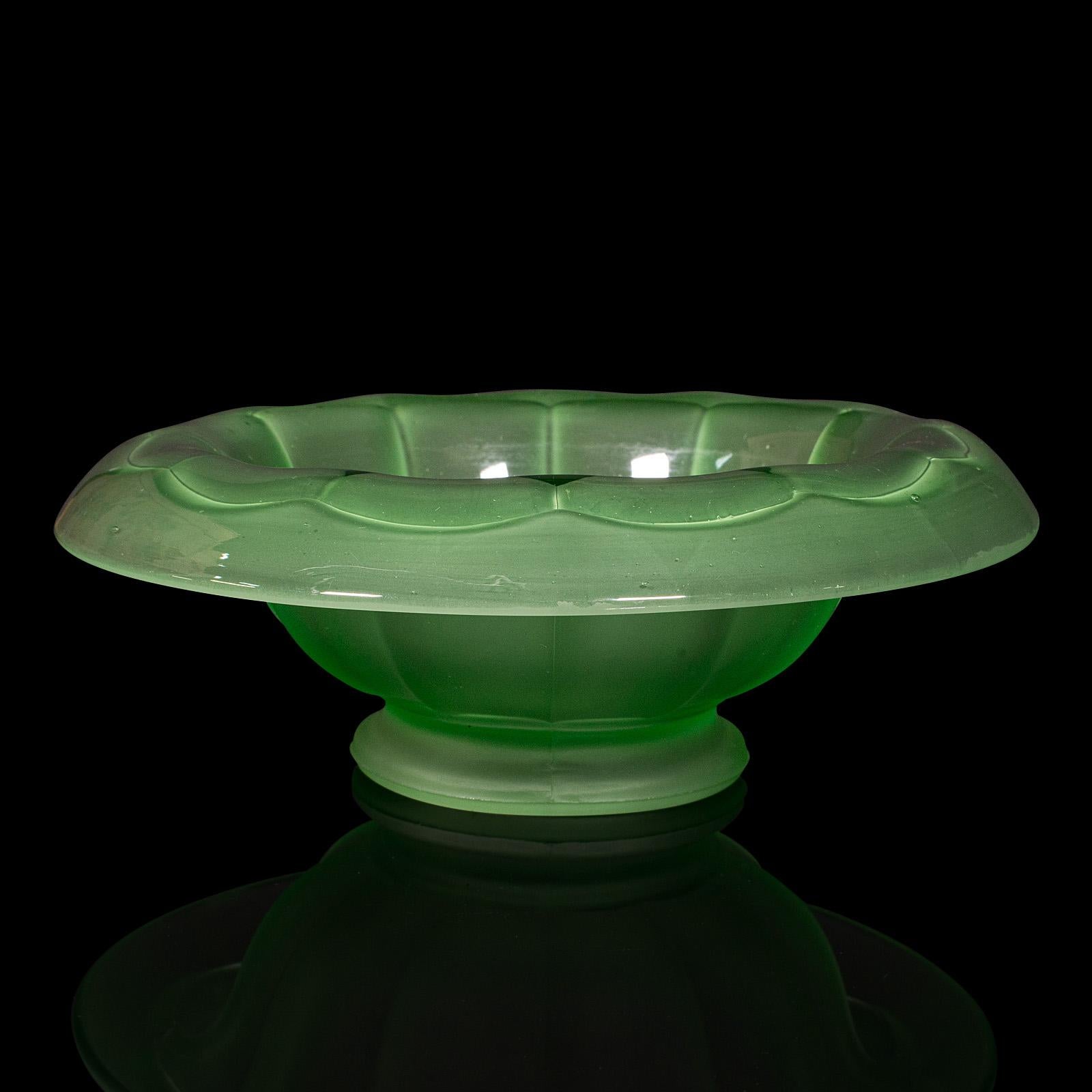 
This is a vintage fruit bowl. An English, glass decorative serving dish, dating to the Art Deco period, circa 1930.

Present your favourite fruit in this delightfully green bowl
Displays a desirable aged patina and in good order
Blown gloss rim
