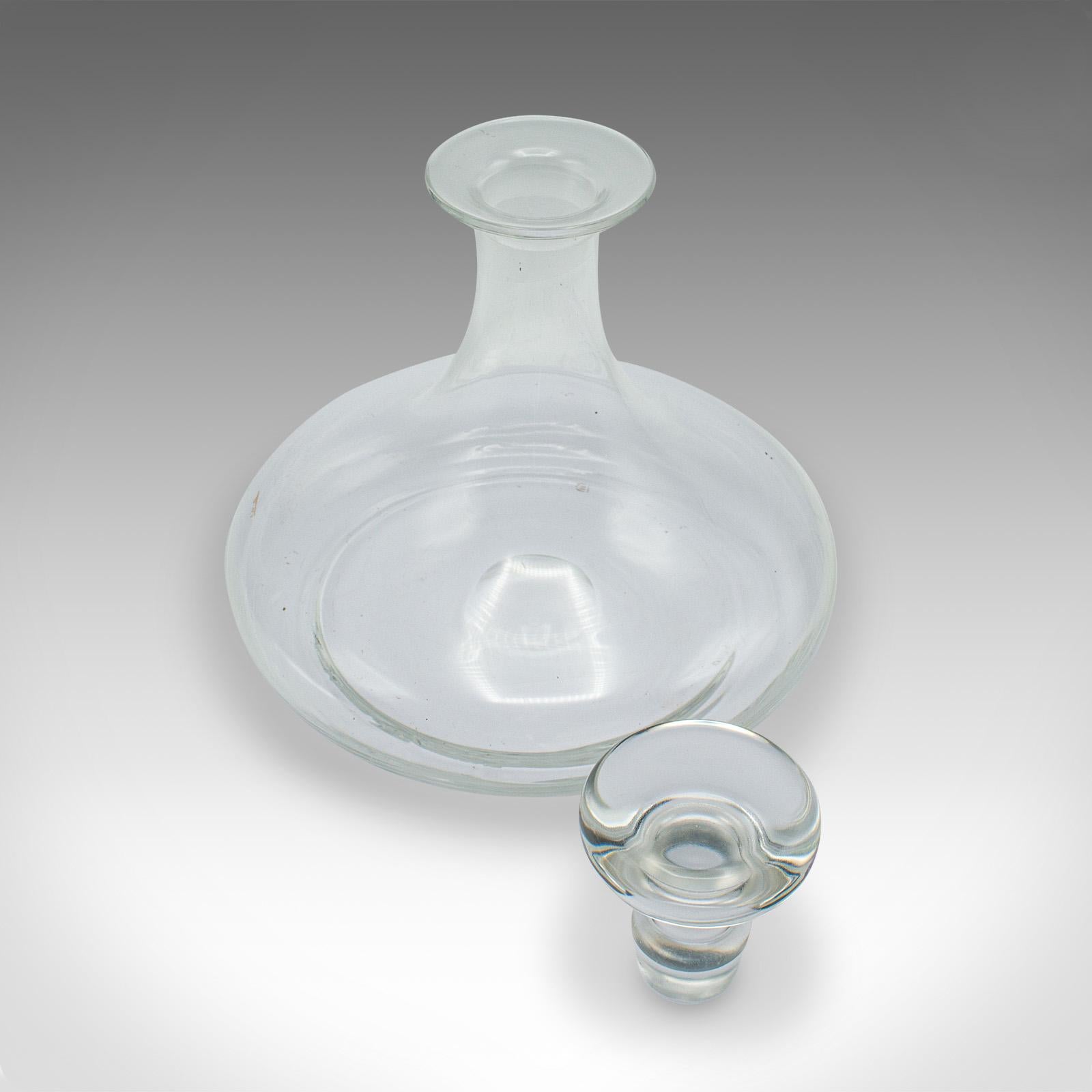 
This is a vintage full bodied red wine decanter. An English, glass Cabernet or Rioja vessel, dating to the late 20th century, circa 1980.

Elegant form, ideal for hosting favourite full bodied wines
Displays a desirable aged patina