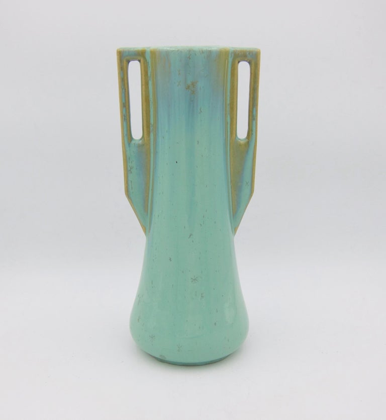 An early 20th century Arts & Crafts vase from Fulper Pottery of Flemington, New Jersey. This substantial piece of American art pottery is Fulper's form 27 featuring a tapering body and two square buttressed handles. The vase is decorated with a