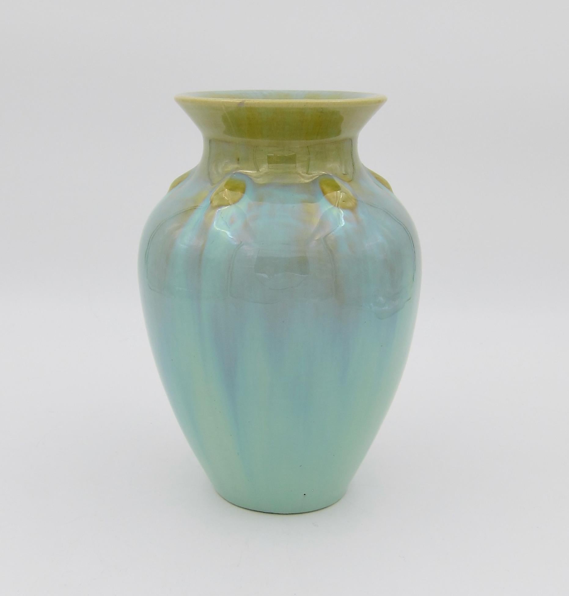 An early 20th century American art pottery vase from Fulper Pottery of Flemington, New Jersey. This is Fulper Pottery's form 532, an Arts & Crafts period vase decorated with an attractive flambé glaze in contrasting shades of frothy green and golden