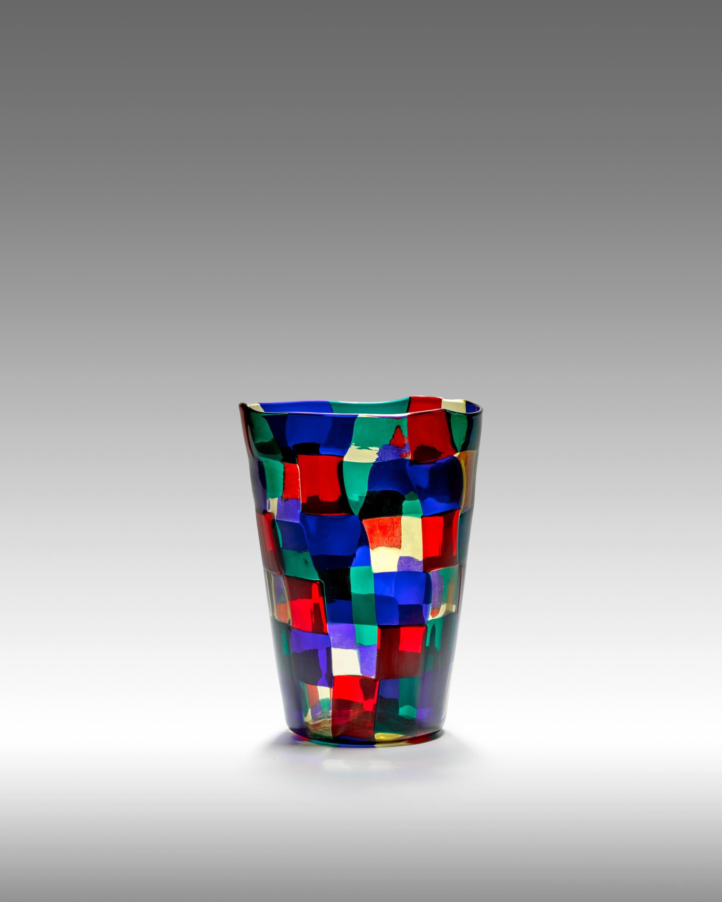 Model 1329 in the 'Paris' colorway of red, blue, green, and hay yellow glass. One of Bianconi's major contributions to the art of glassmaking, the Pezzato series premiered at the 1950 Venice Biennale where it won top honors in its area. The extreme