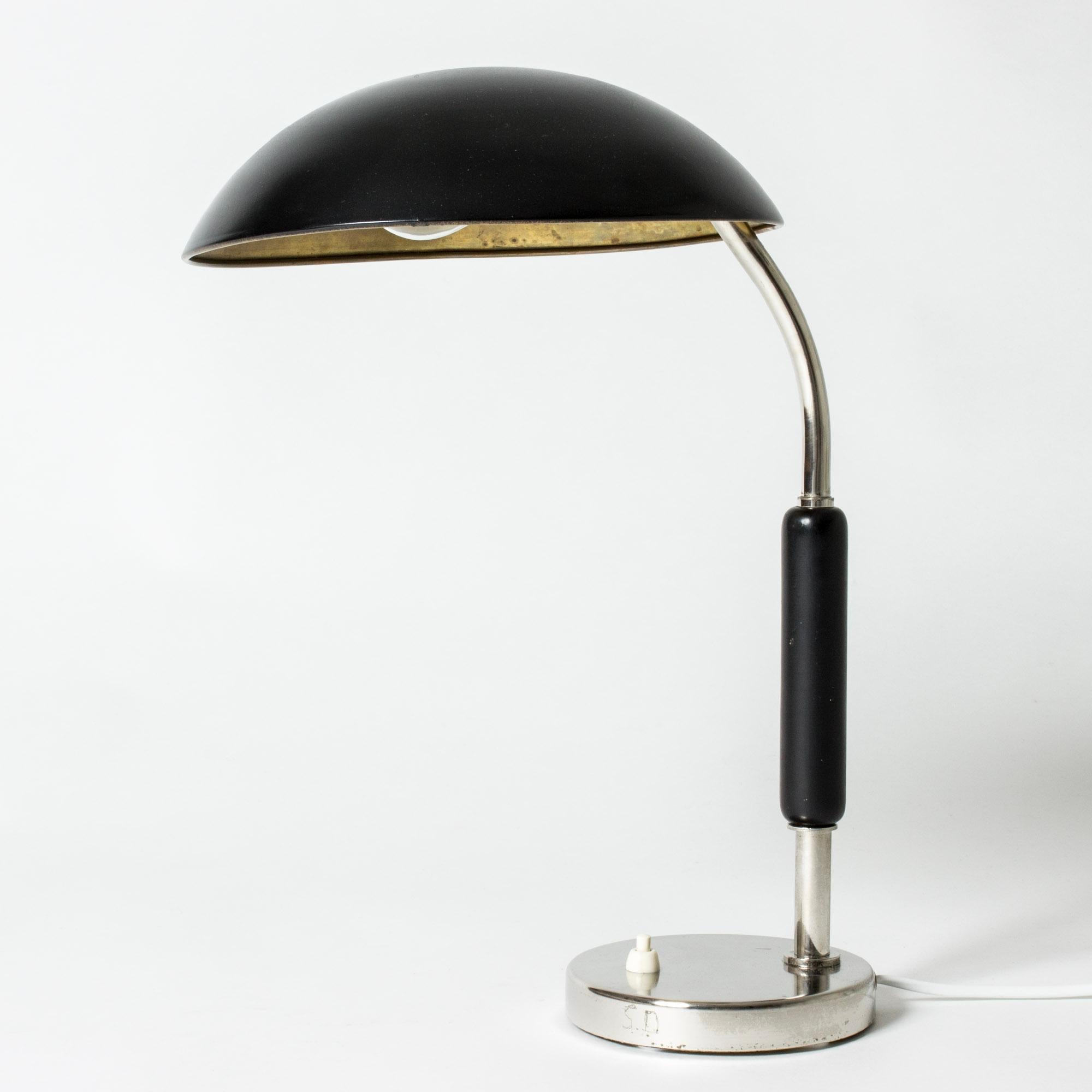 Cool functionalist table or desk lamp from ASEA, with smooth, graphic lines. Black wooden handle and black lacquered shade.