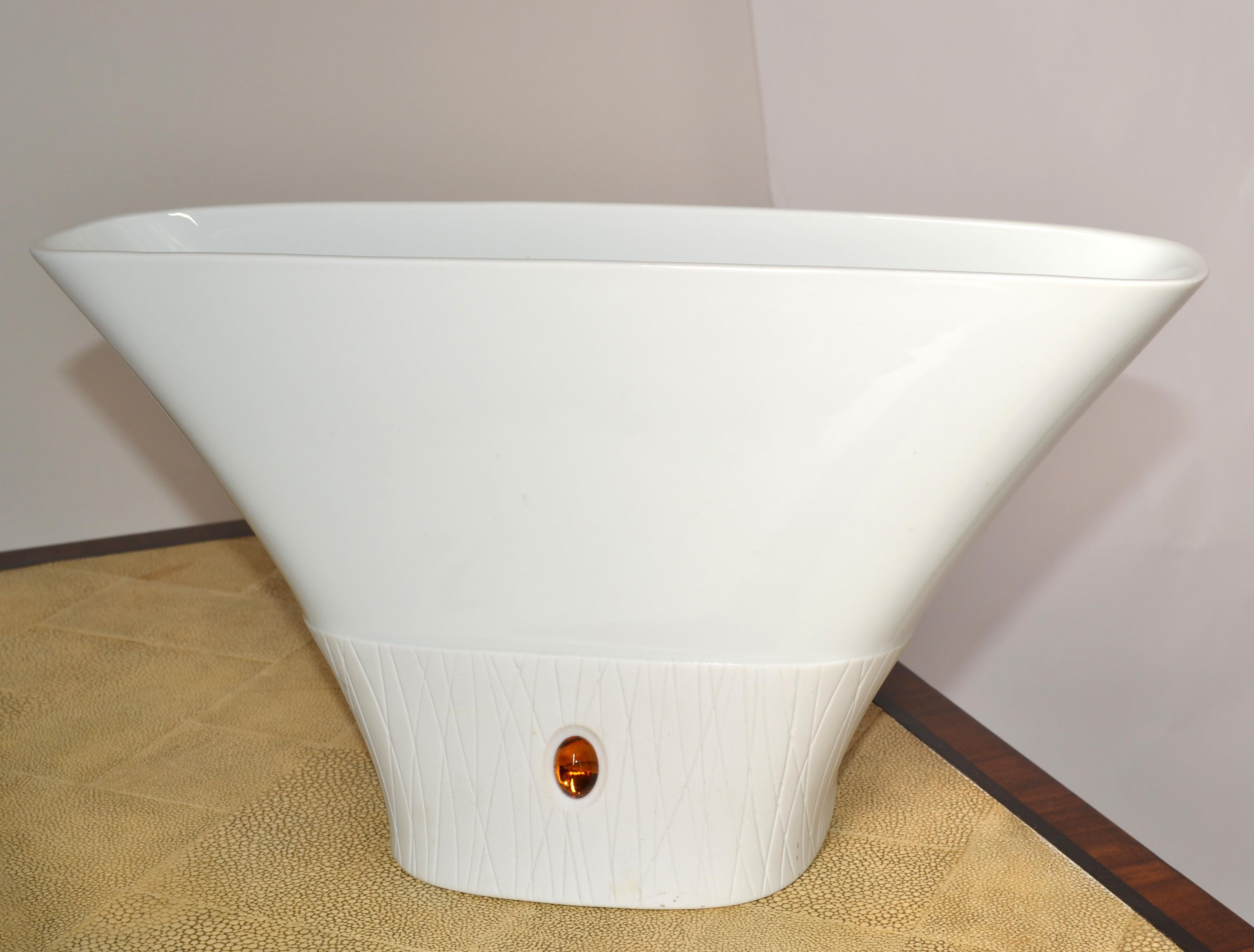Decorative white textured porcelain vase with amber golden sandstone inlay.
Handmade Porcelain Vase with Character an elegant decorative Gem by itself.  
Trademark at the Base, FÜRSTENBERG Germany.
The opening measures: 13 x 3 inches.
The care and