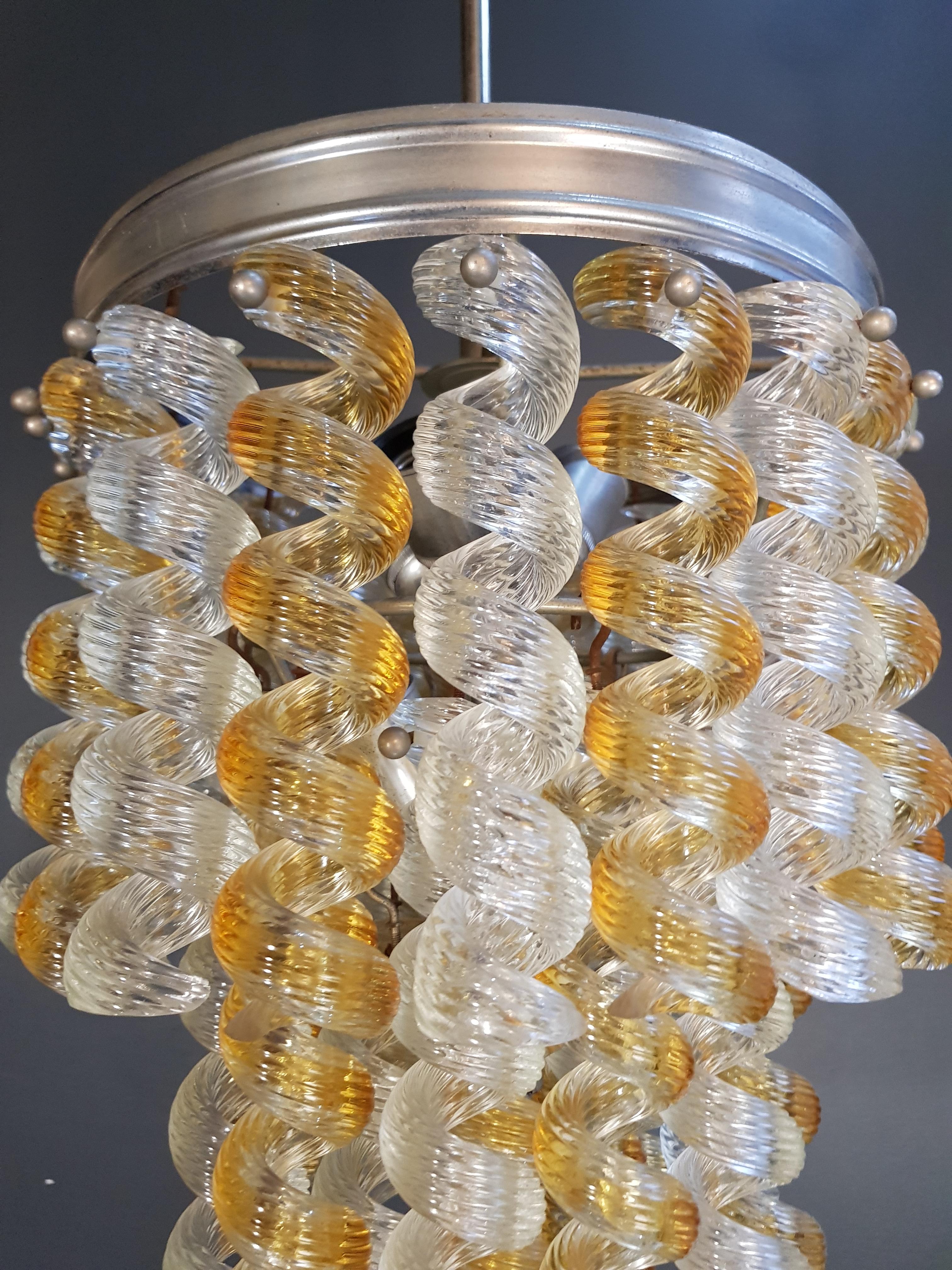 Vintage Italian yellow and clear Murano glass pendant or chandelier.

Measures: Total height: 85 cm, height without chain: 50 cm, diameter 35 cm, weight (approximately) 13 kg.

Number of lights: 6-light bulb sockets: E27

Vintage Fusilli
