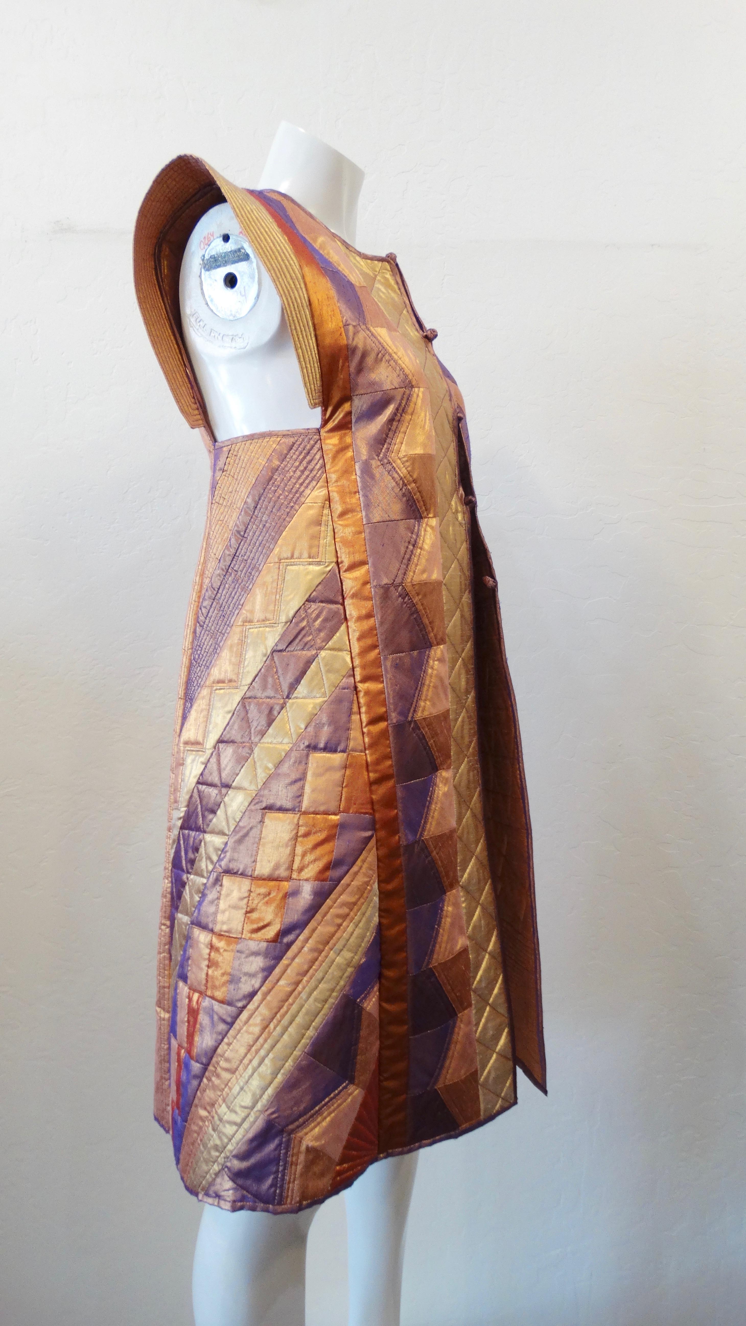 Super unique vintage handmade quilted patchwork jacket! Made up of satins in   shades of gold, bronze and purple! Intricate quilting and patchwork details throughout the entire jacket. The structured sleeves and modest neckline give this piece an