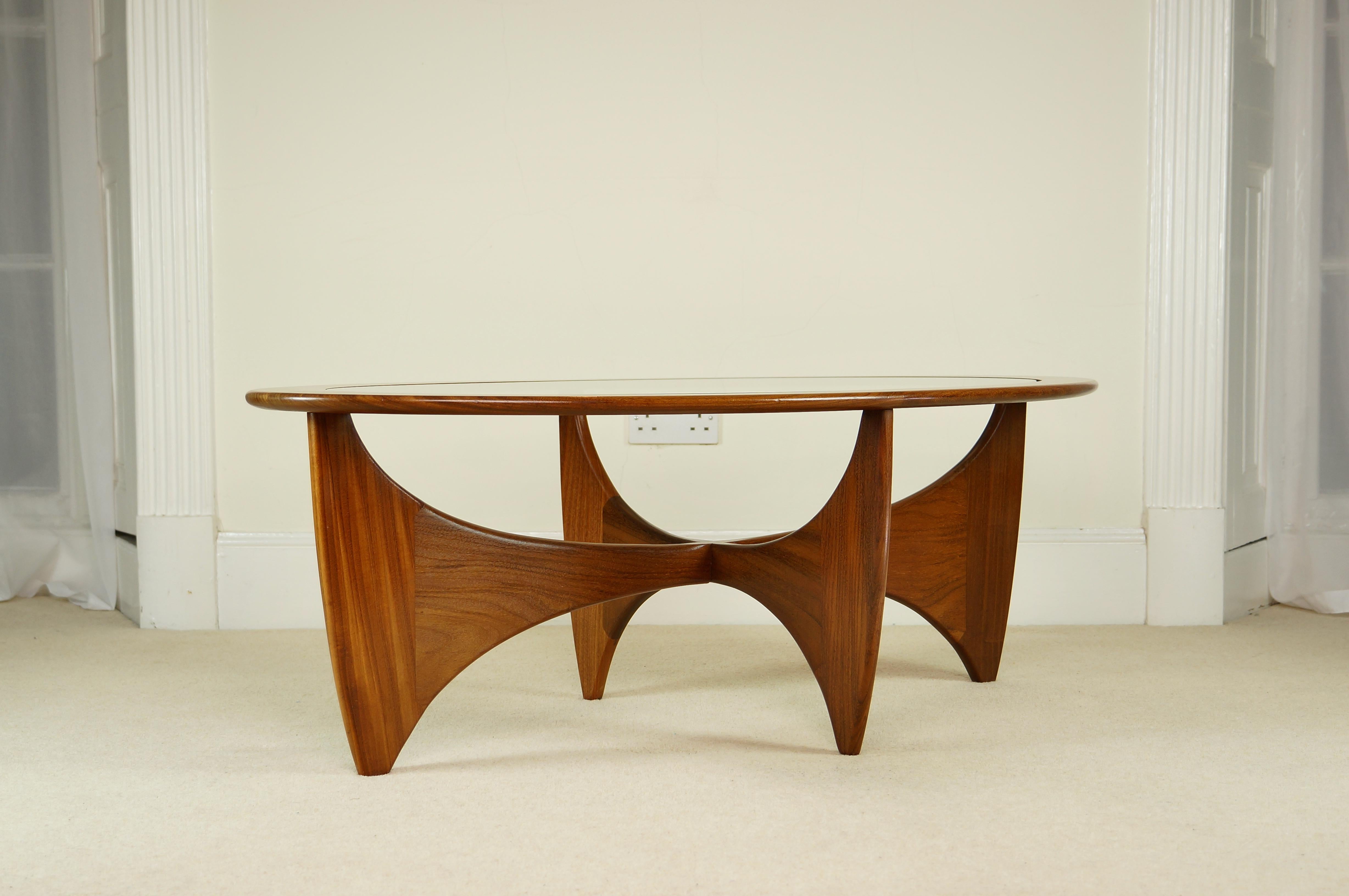 Vintage G Plan astro coffee table

A gorgeous example of this design by V B Wilkins for G Plan from the 1960's, retaining it's original label.

The sculptural solid teak frame is of high quality construction and shows fantastic grain with a