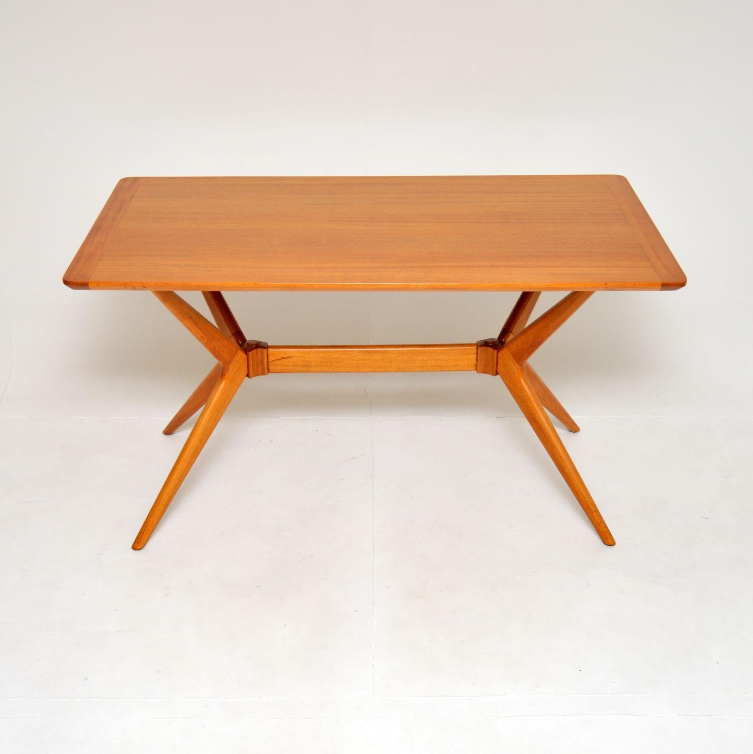 A stunning vintage G Plan Redford dining table. This model is also sometimes known as the helicopter table, it was made in England, and dates from the 1950’s.

It is beautifully made with an interesting deign, the construction is solid Agba wood,