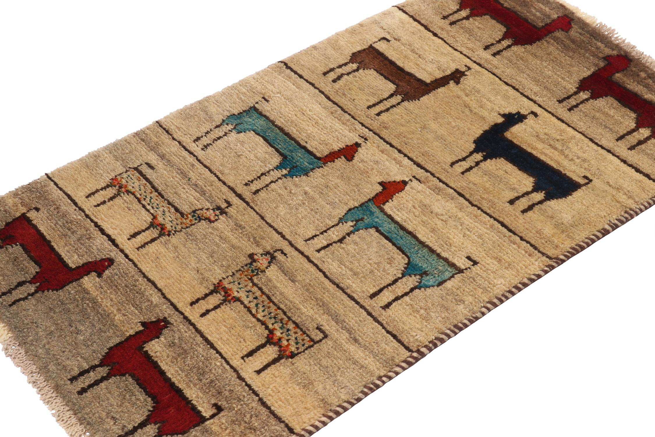 A vintage 2x3 Persian Gabbeh rug, from a grand entry to Rug & Kilim’s curation of rare tribal pieces. Hand-knotted in wool circa 1950-1960. 

On the Design: 

This mid-century piece features colorful animal pictorials in red, blue and brown atop