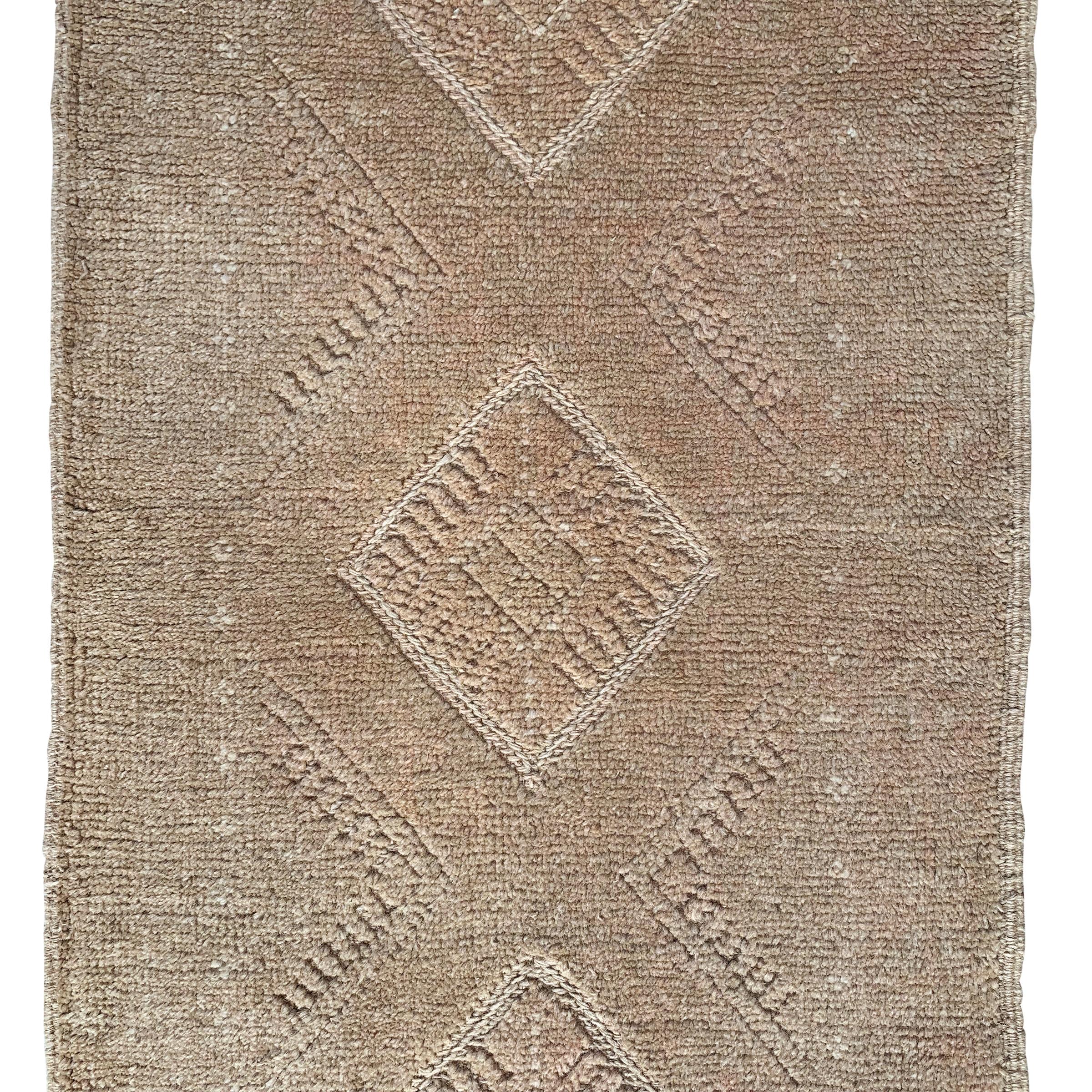 A wonderful 21st century Persian Gabbeh runner with a beautiful tone on tone woven pattern containing multiple diamonds running the length of the rug.