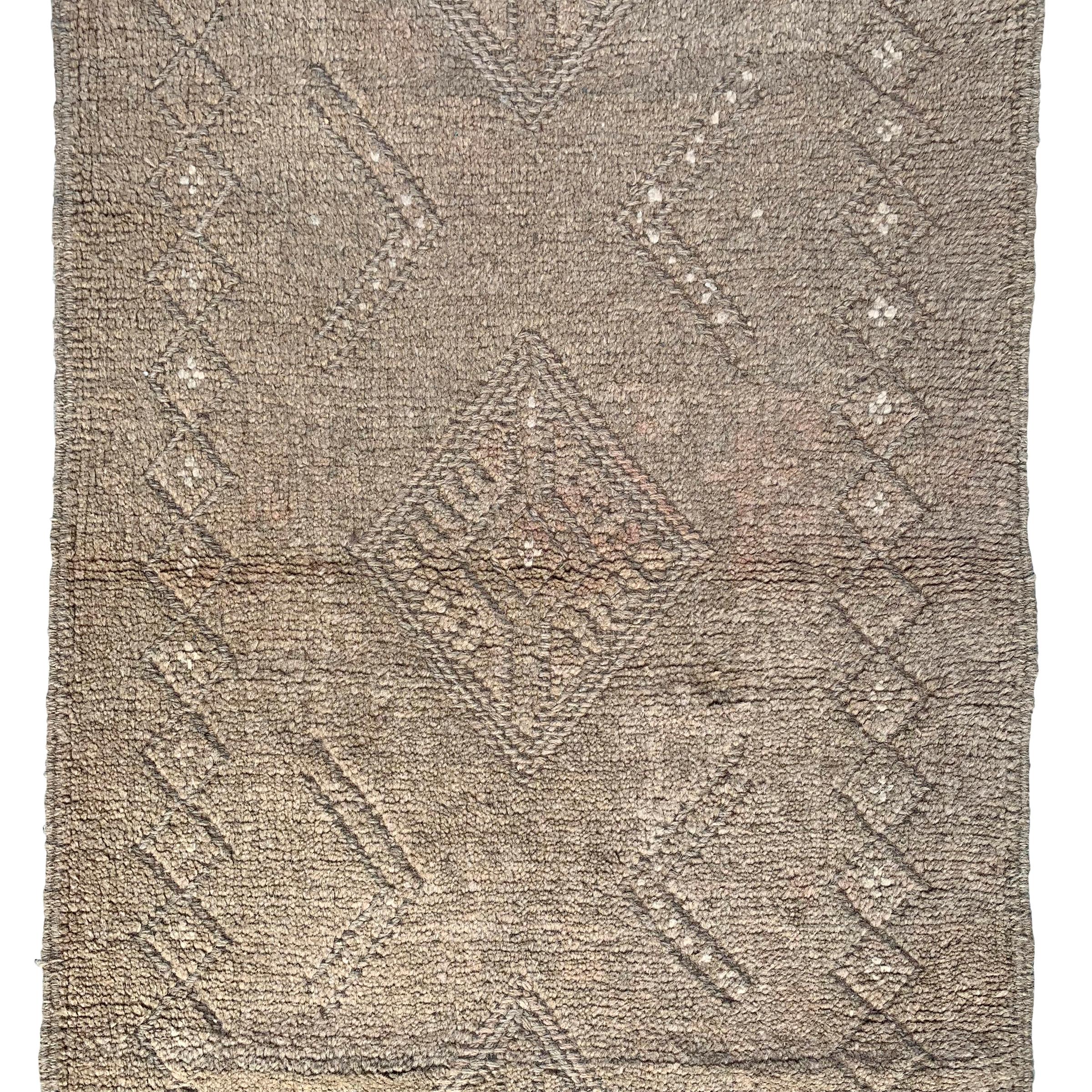 A wonderful vintage late 20th century Persian Gabbeh runner with a beautiful tone on tone woven pattern containing multiple diamonds running the length of the rug.