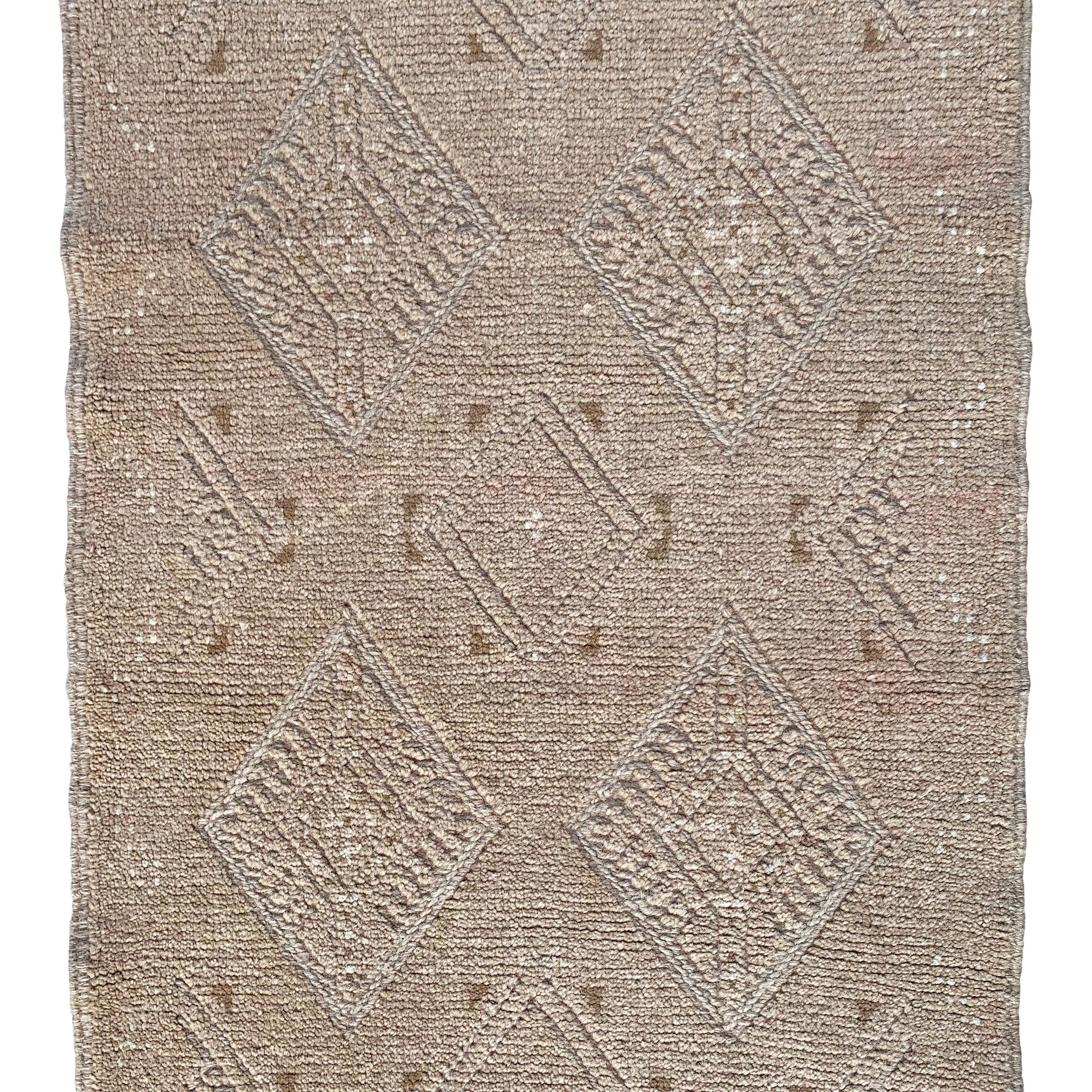 A wonderful vintage late 20th century Persian Gabbeh runner with a beautiful tone on tone woven pattern containing multiple diamonds running the length of the rug.