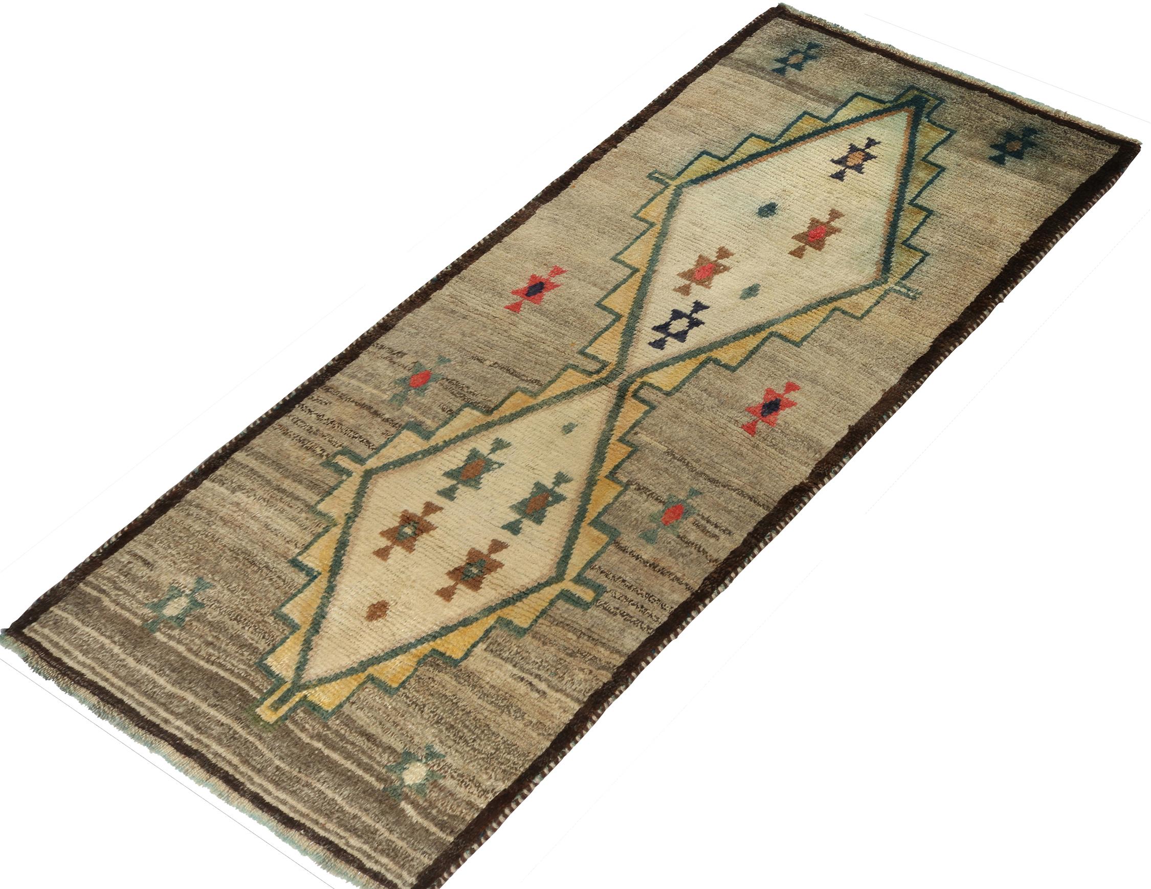 A vintage 3x6 Persian Gabbeh runner, from the latest grand entry to Rug & Kilim’s curation of rare tribal pieces. Hand-knotted in wool circa 1950-1960.

Further On the Design:

This mid-century piece enjoys diamond medallions in gray, gold and