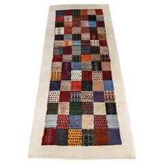 Vintage Gabbeh Runner Rug with geometric and animal pattern