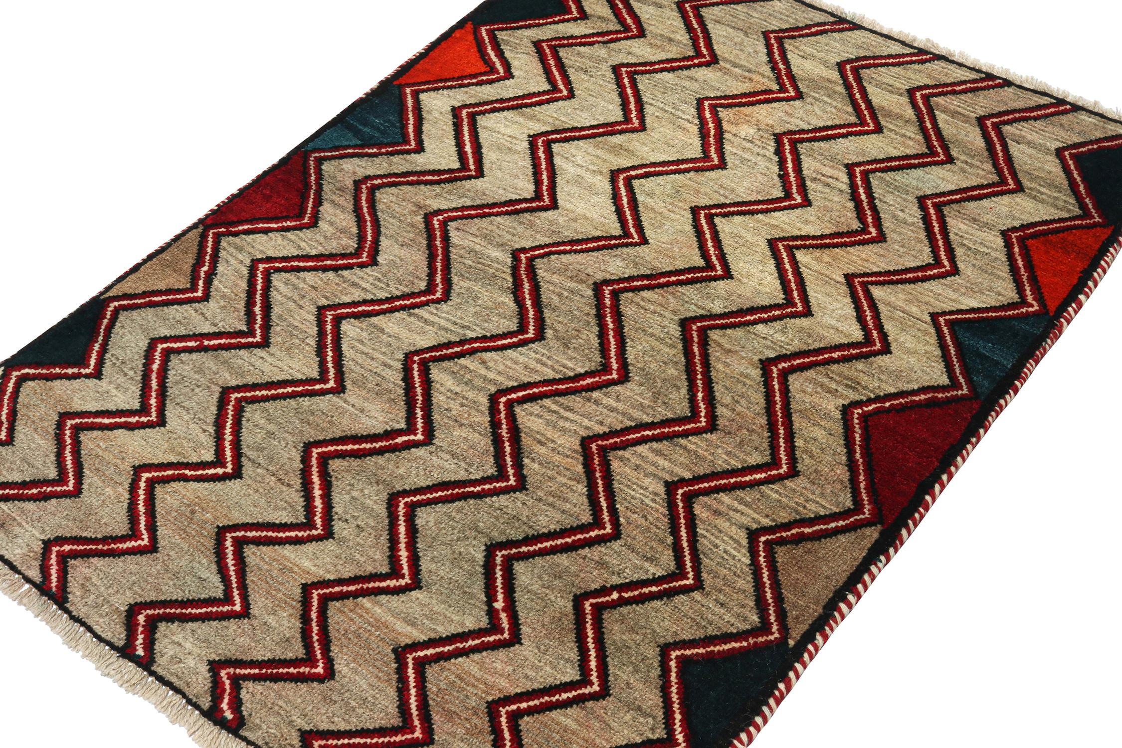 A vintage 3x5 Persian Gabbeh rug, from a grand entry to Rug & Kilim’s curation of rare tribal pieces. Hand-knotted in wool circa 1950-1960. 

On the Design: 

This mid-century piece features a series of chevrons and geometric patterns in