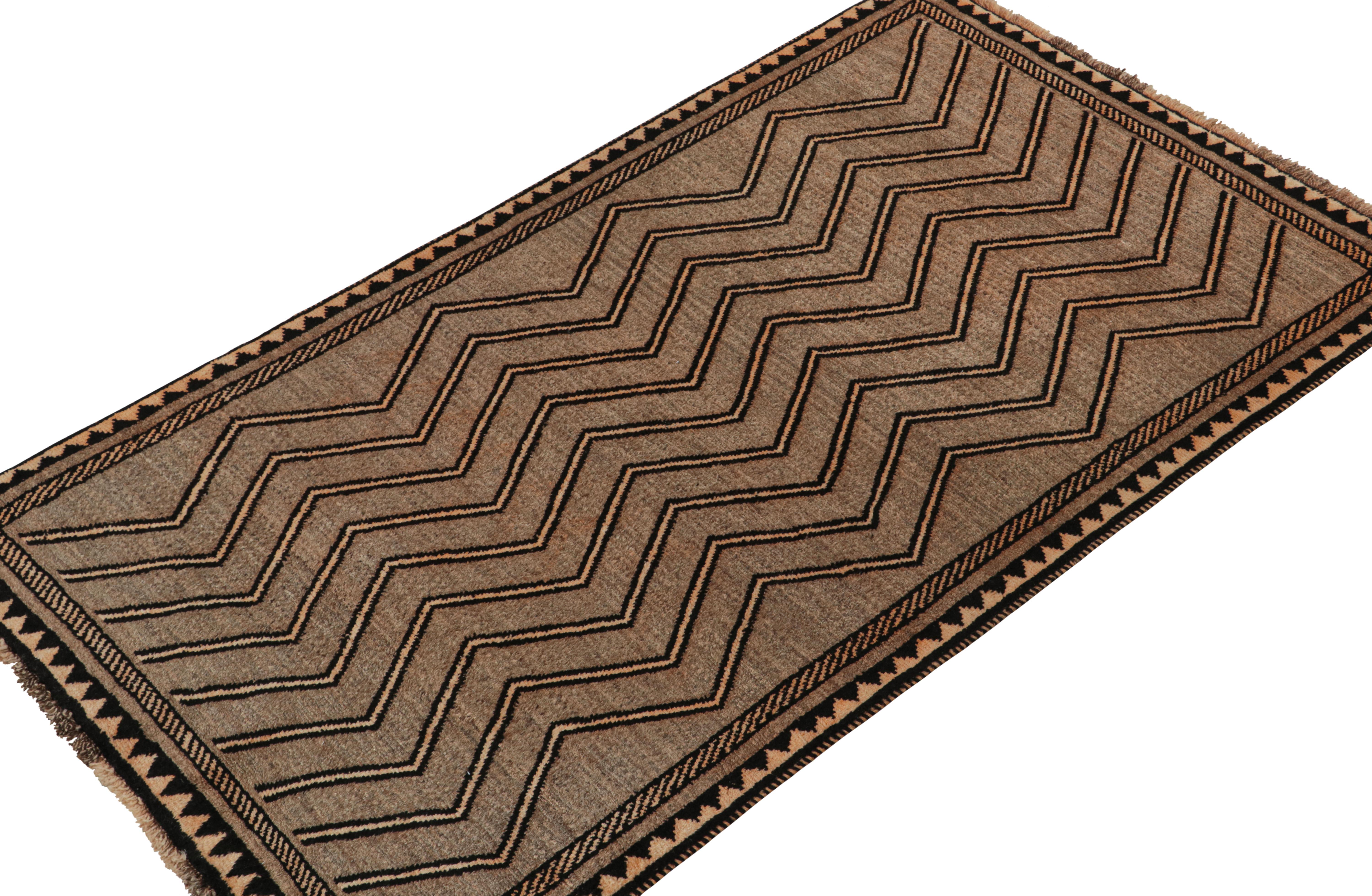 A vintage 4x7 Persian Gabbeh rug in the latest entries to Rug & Kilim’s curation of rare tribal pieces. Hand-knotted in wool circa 1950-1960.

On the Design:

This pattern enjoys chevrons in beige-brown & black. Lush pile further exemplifies the