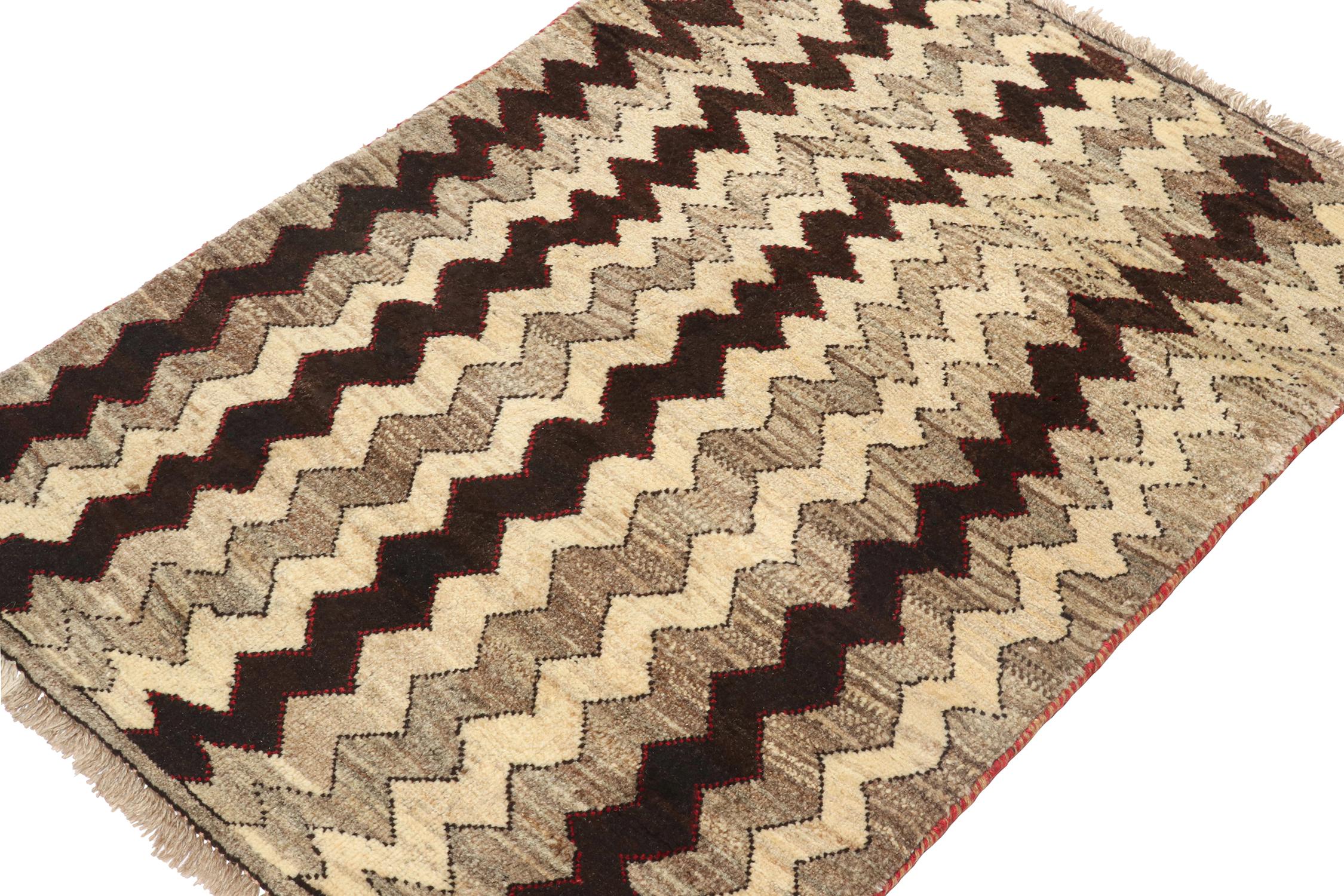 A vintage 3x4 Persian Gabbeh rug in the latest entries to Rug & Kilim’s curation of rare tribal pieces. Hand-knotted in wool circa 1950-1960.

On the Design:

This pattern enjoys chevrons in beige-brown and black, and keen eyes may admire red