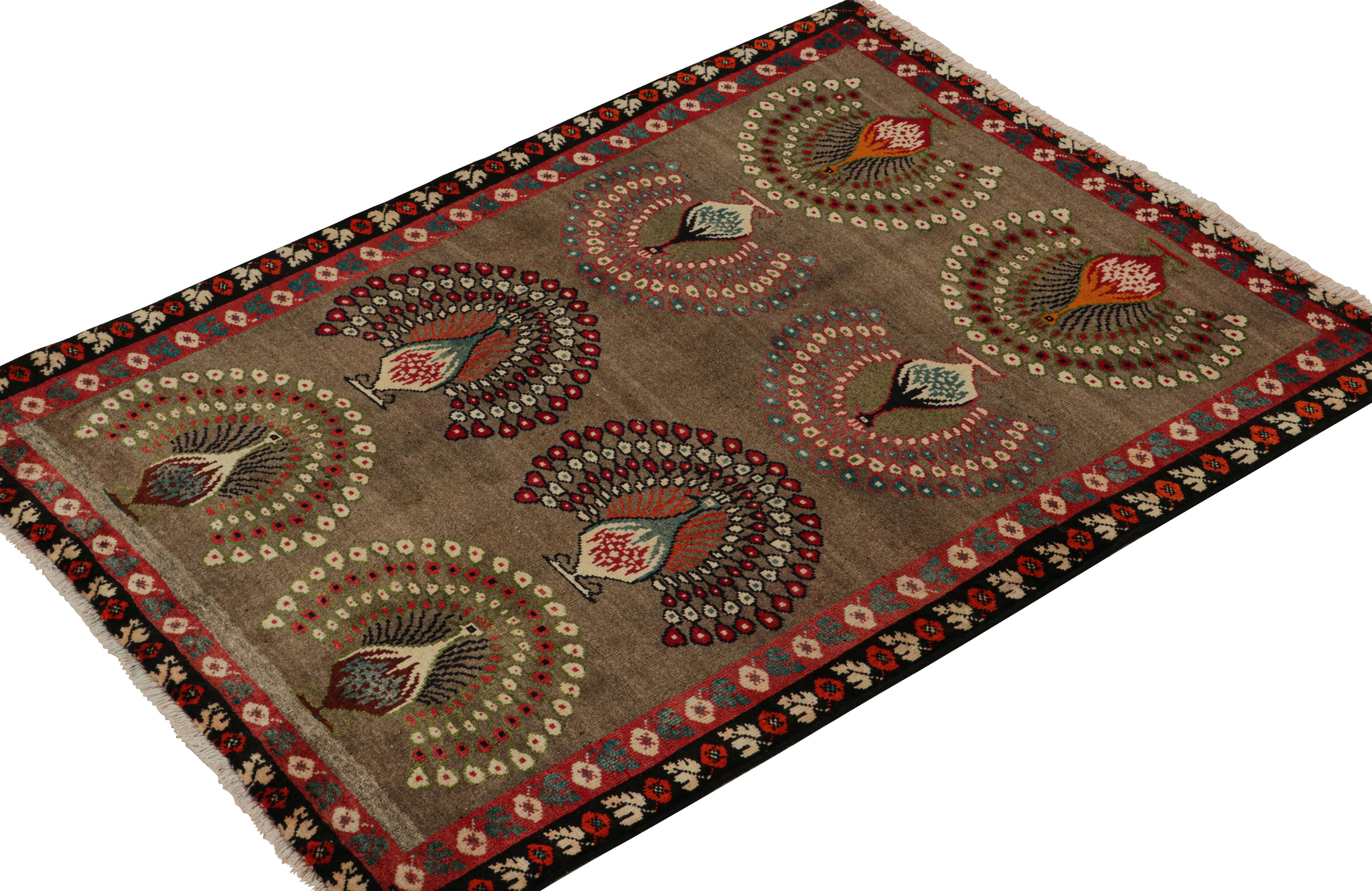 This vintage 4x5 Gabbeh Persian rug is from the latest entries in Rug & Kilim’s rare tribal curations. Hand-knotted in wool circa 1950-1960.

On the Design:

This tribal provenance is one of the most primitive, and collectible shabby-chic styles