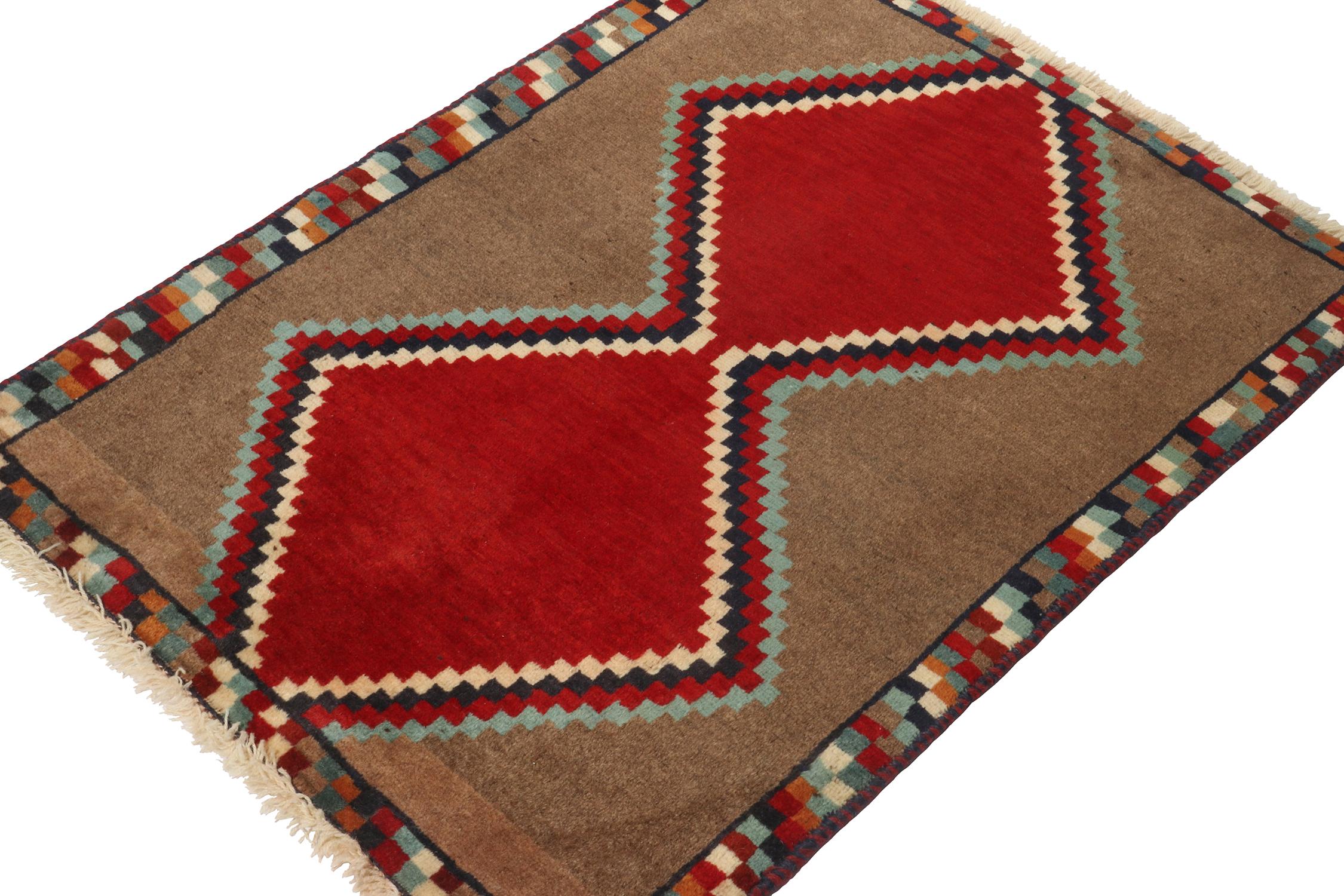 A vintage 2x4 Persian Gabbeh rug, from the latest grand entry to Rug & Kilim’s curation of rare tribal pieces. Hand-knotted in wool circa 1950-1960. 

On the Design: 

This mid-century piece features red diamond medallions atop a rich brown