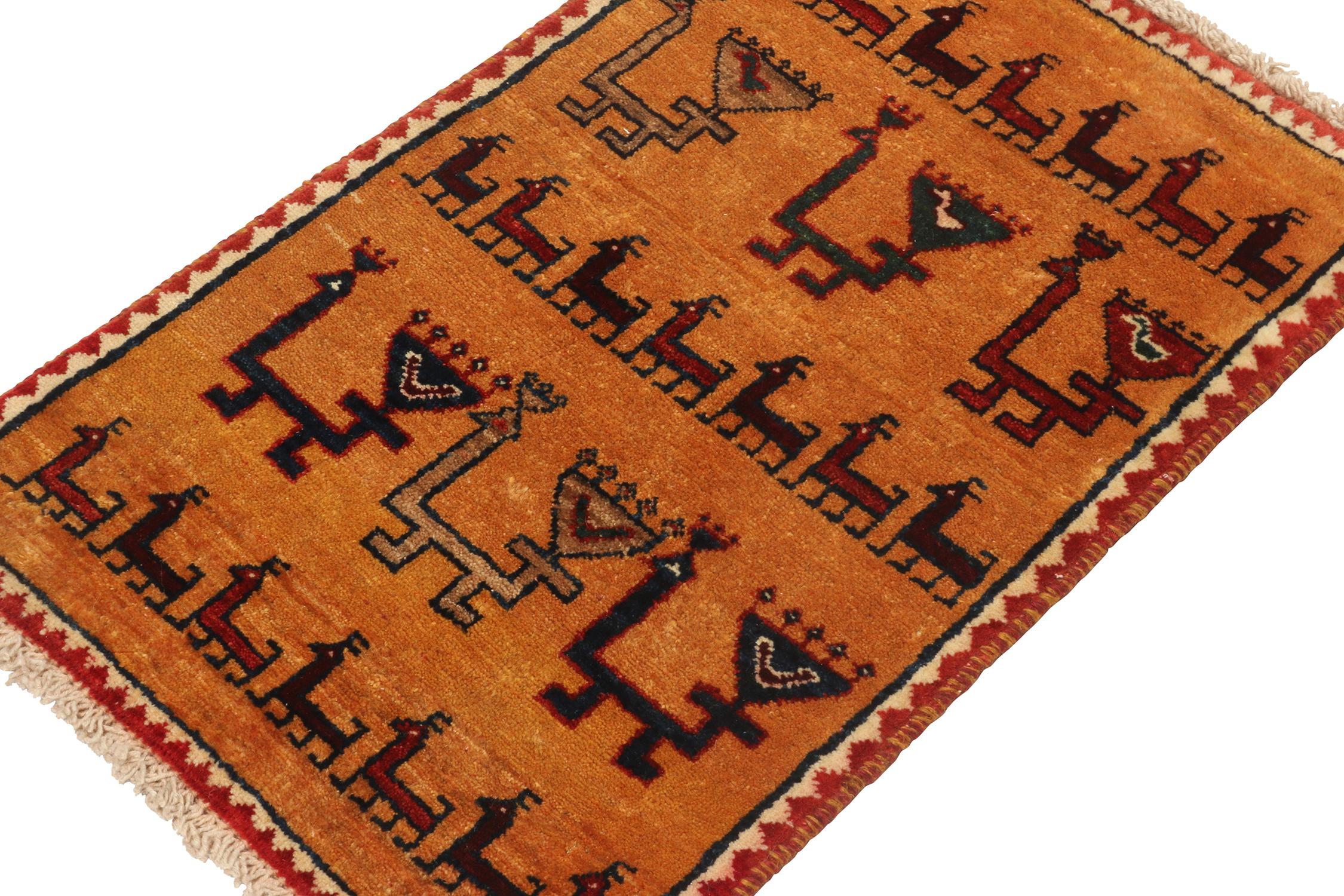 A vintage 2x3 Persian Gabbeh rug in the latest additions to Rug & Kilim’s curation of rare tribal pieces. Hand-knotted in wool circa 1950-1960.

On the Design:

This mid-century piece features animal pictorials in red and beige-brown atop a warm