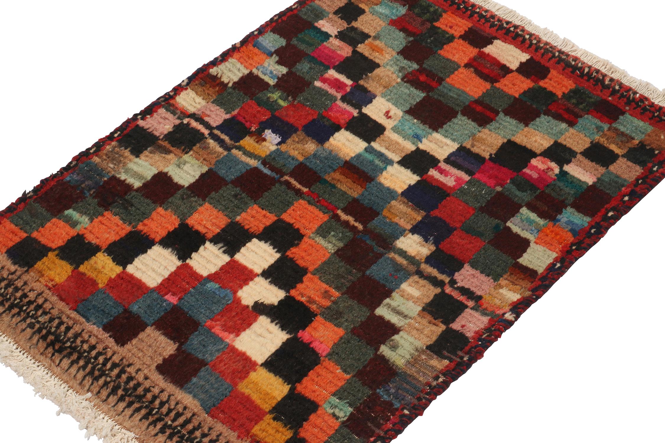 A vintage 2x3 Persian Gabbeh rug, from a grand new entry in Rug & Kilim’s curation of rare tribal pieces. Hand-knotted in wool circa 1950-1960. 

On the Design: 

The piece features a tribal geometric pattern in a whimsical polychromatic