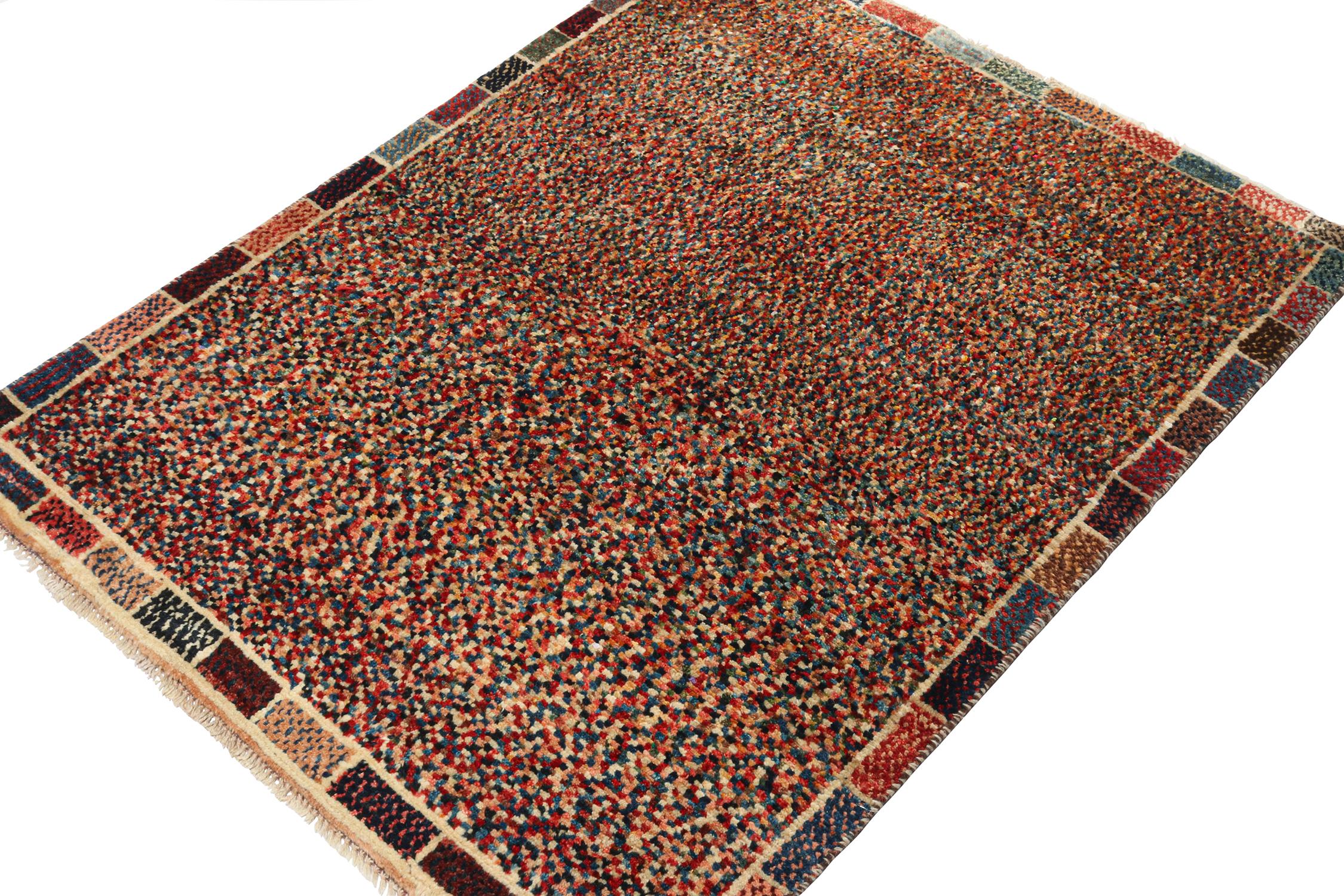 A vintage 3x4 Persian Gabbeh rug, making a grand entry to Rug & Kilim’s curation of rare tribal pieces. Hand-knotted in wool, originating circa 1950-1960.

On the Design:

This piece features a gorgeous play of polychromatic tones to complement