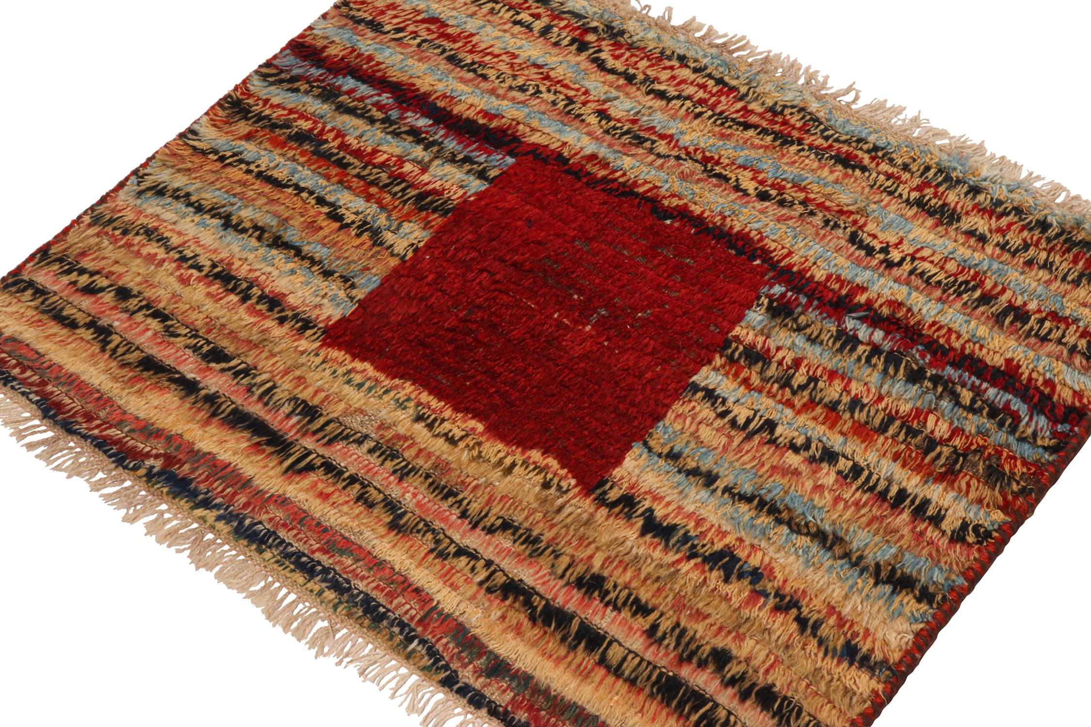 A vintage 3x3 Persian Gabbeh rug, making a grand entry to Rug & Kilim’s curation of rare tribal pieces. Hand-knotted in wool, originating circa 1950-1960.

On the Design:

This piece features a lively play of polychromatic stripes, which sits