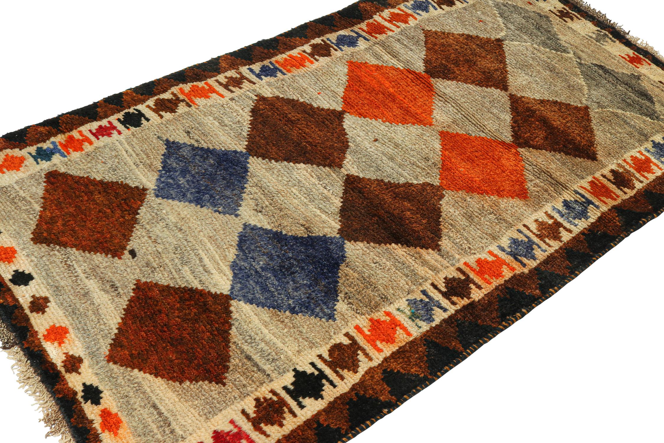 A vintage 3x6 Persian Gabbeh rug, from the latest grand entry to Rug & Kilim’s curation of rare tribal pieces. Hand-knotted in wool circa 1950-1960. 

On the Design: 

This mid-century piece features diamond medallions in orange, brown and blue
