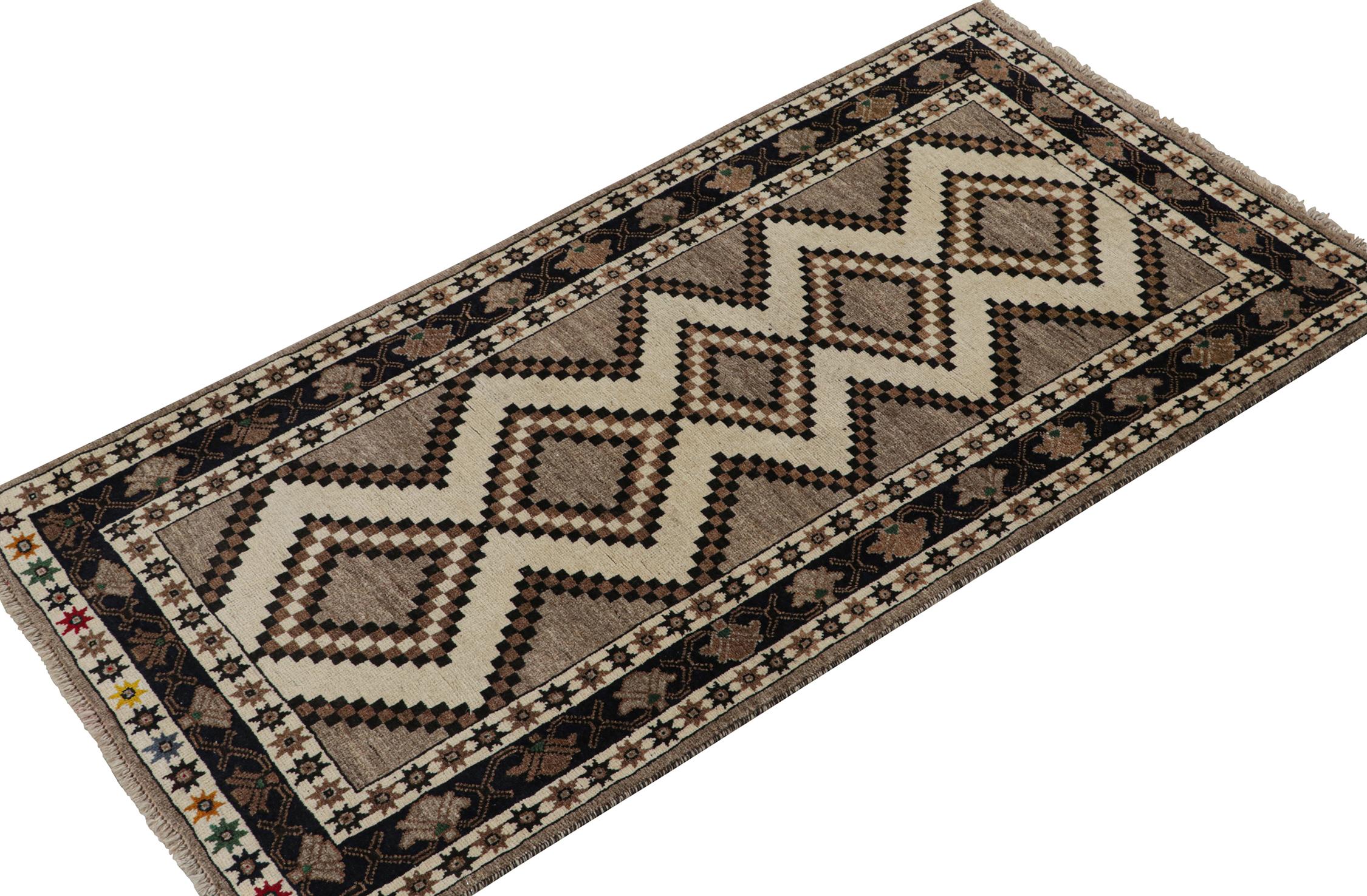 A vintage 4x7 Persian Gabbeh rug, from the latest grand entry to Rug & Kilim’s curation of rare tribal pieces. Hand-knotted in wool circa 1950-1960.

On the Design:

This mid-century piece features beige-brown and black diamond medallions atop a