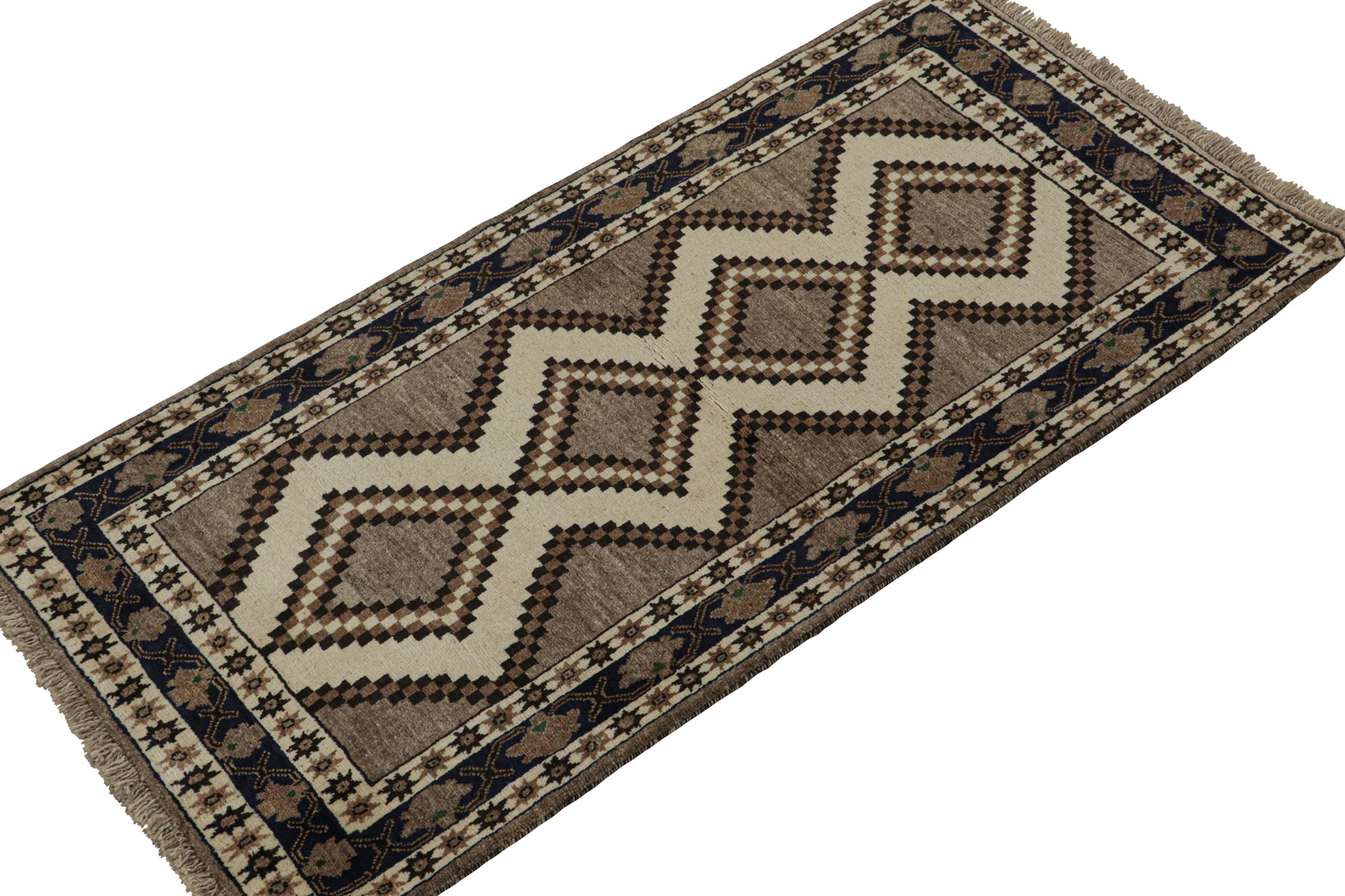 A vintage 4x7 Persian Gabbeh rug, from the latest grand entry to Rug & Kilim’s curation of rare tribal pieces. Hand-knotted in wool circa 1950-1960.

On the Design:

This mid-century piece features beige-brown and black diamond medallions atop a