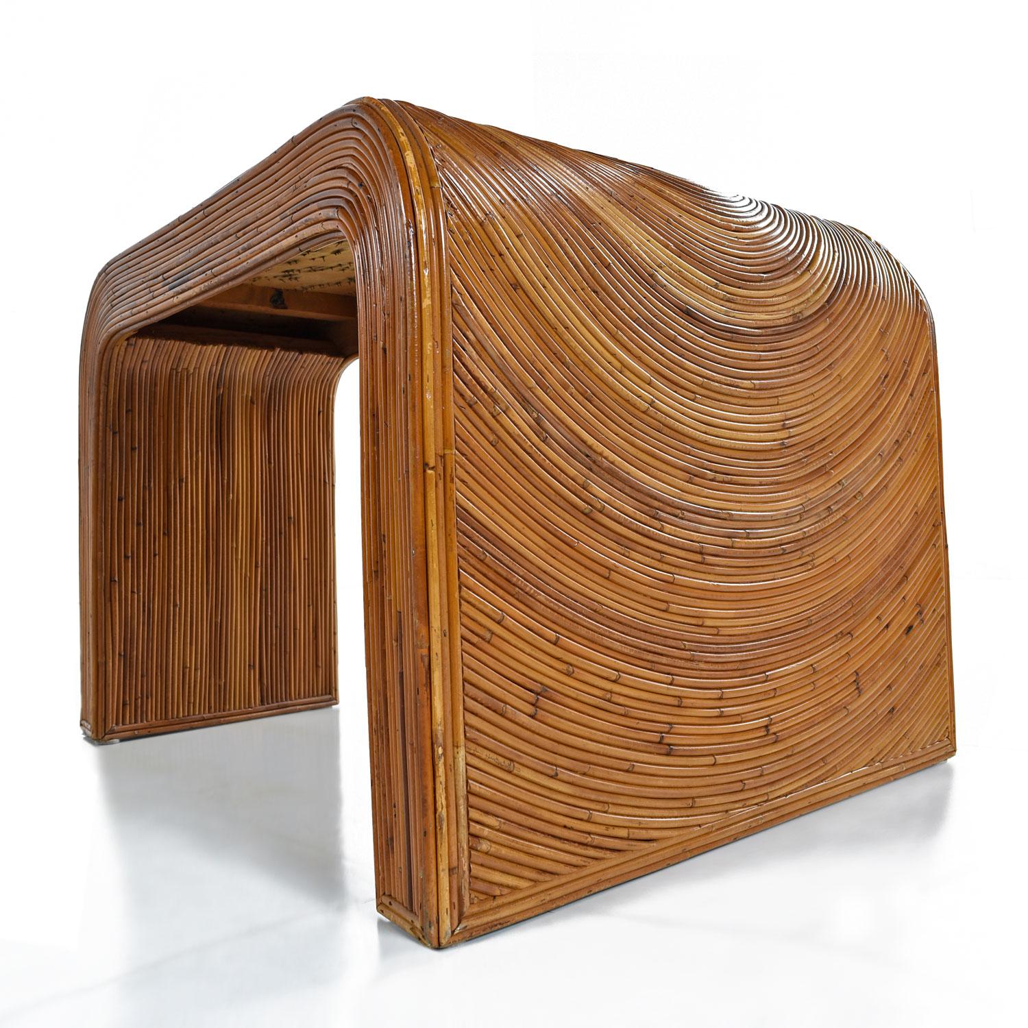 Easily place this wedge shaped Gabriella Crespi style side table between two arm chairs, a single chair, or between two sofas. The space saving design allows you to make the most of your home without sacrificing style. The earthy pencil reed motif