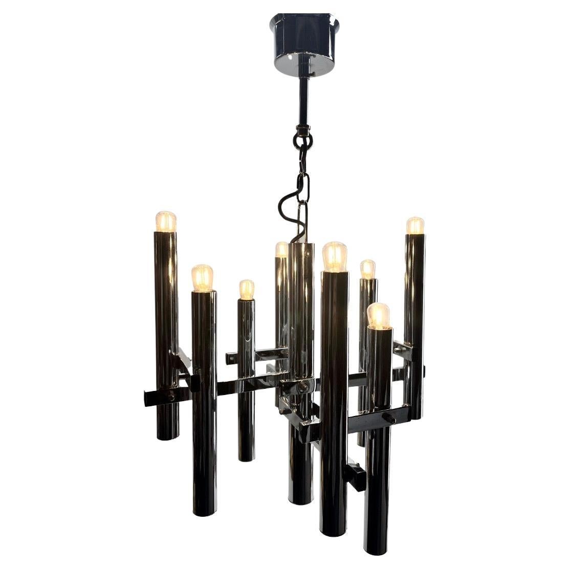 Vintage Sciolari Chandelier Italian Modern 8 lights Pendant

From the range by Sciolari, this center-light features 8 lamps  on a central chromed stem. 
Each lamp has a fitting  E14 on a chromed plate Tube 
In good condition and in full working