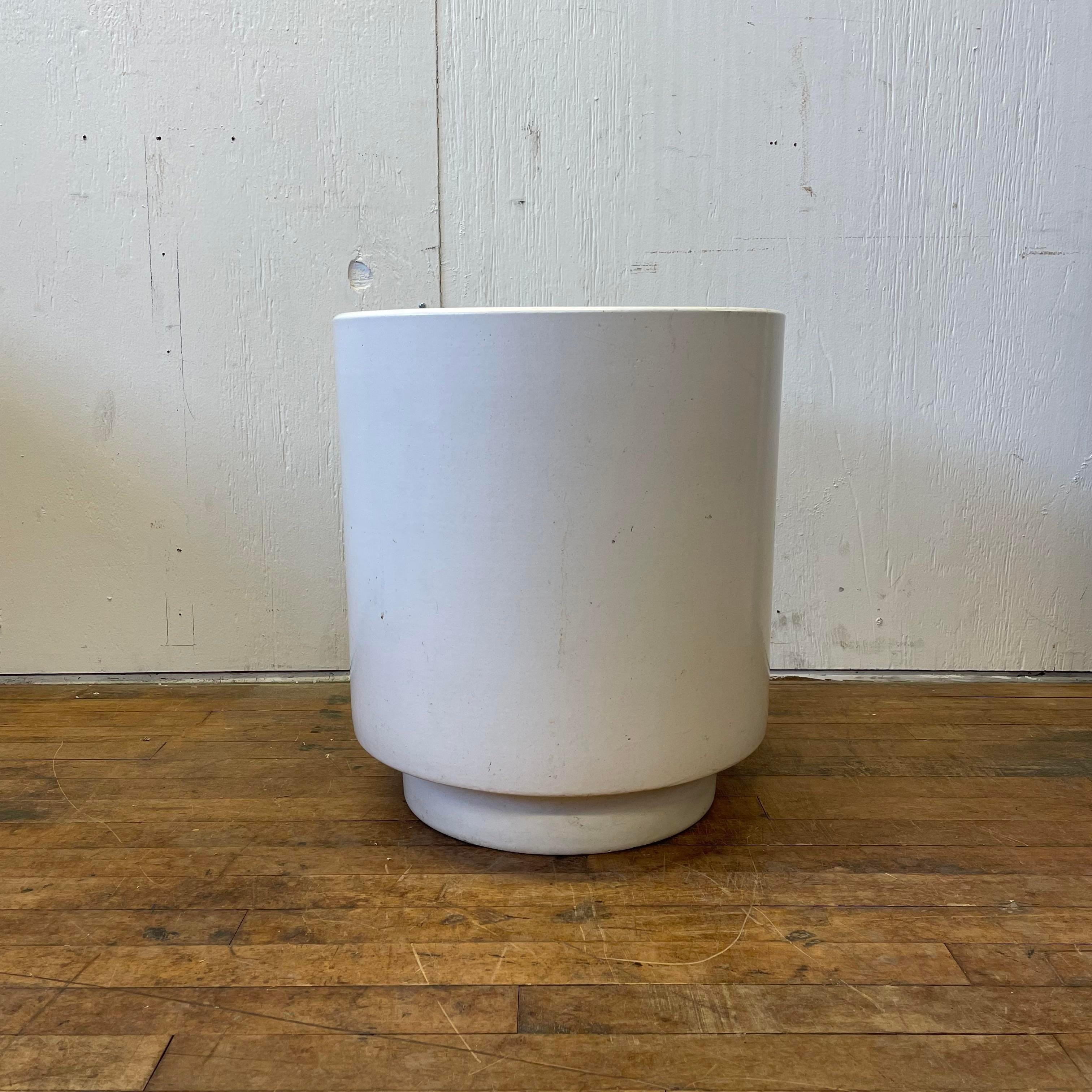 A large cylindrical cream-colored Gainey planter. Perfect for a small tree or another large plant. Great condition, with a few minor scuffs from age and use. Purchased from a California estate.