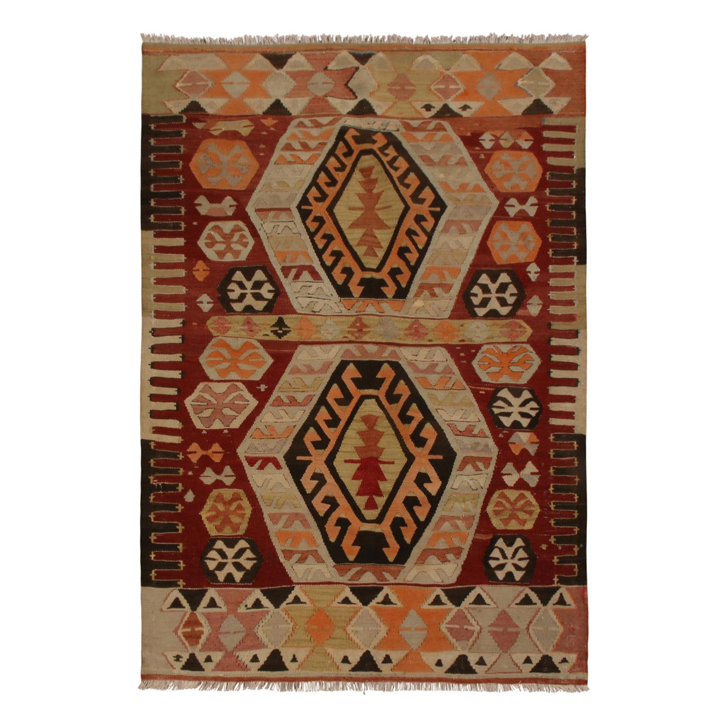 Flat-woven in high-quality wool originating from Turkey between 1940-1950, this vintage Gal Kilim rug hosts an intriguing pallet of vibrant rich and pastel colorways complementing a very Moroccan sense of joyful, tribal geometry, enjoying the finest