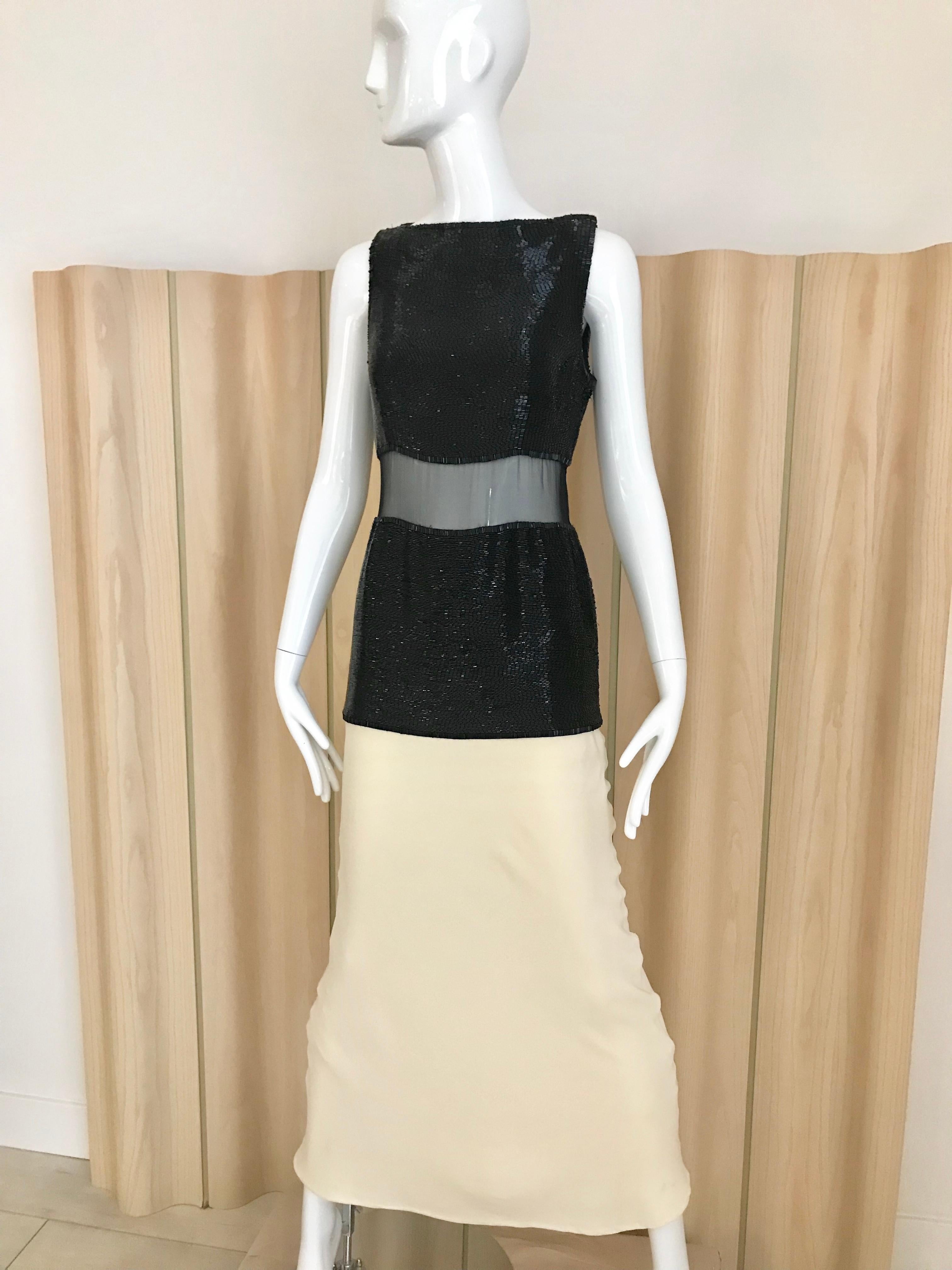 Beautiful and chic vintage Galanos black and creme gown. Bodice part embellished with beautiful bugle beads. Dress has sheer silk chiffon on waist area. Size zipper with secure hook an eye on shoulder. Perfect for wedding dress or Cocktail party.