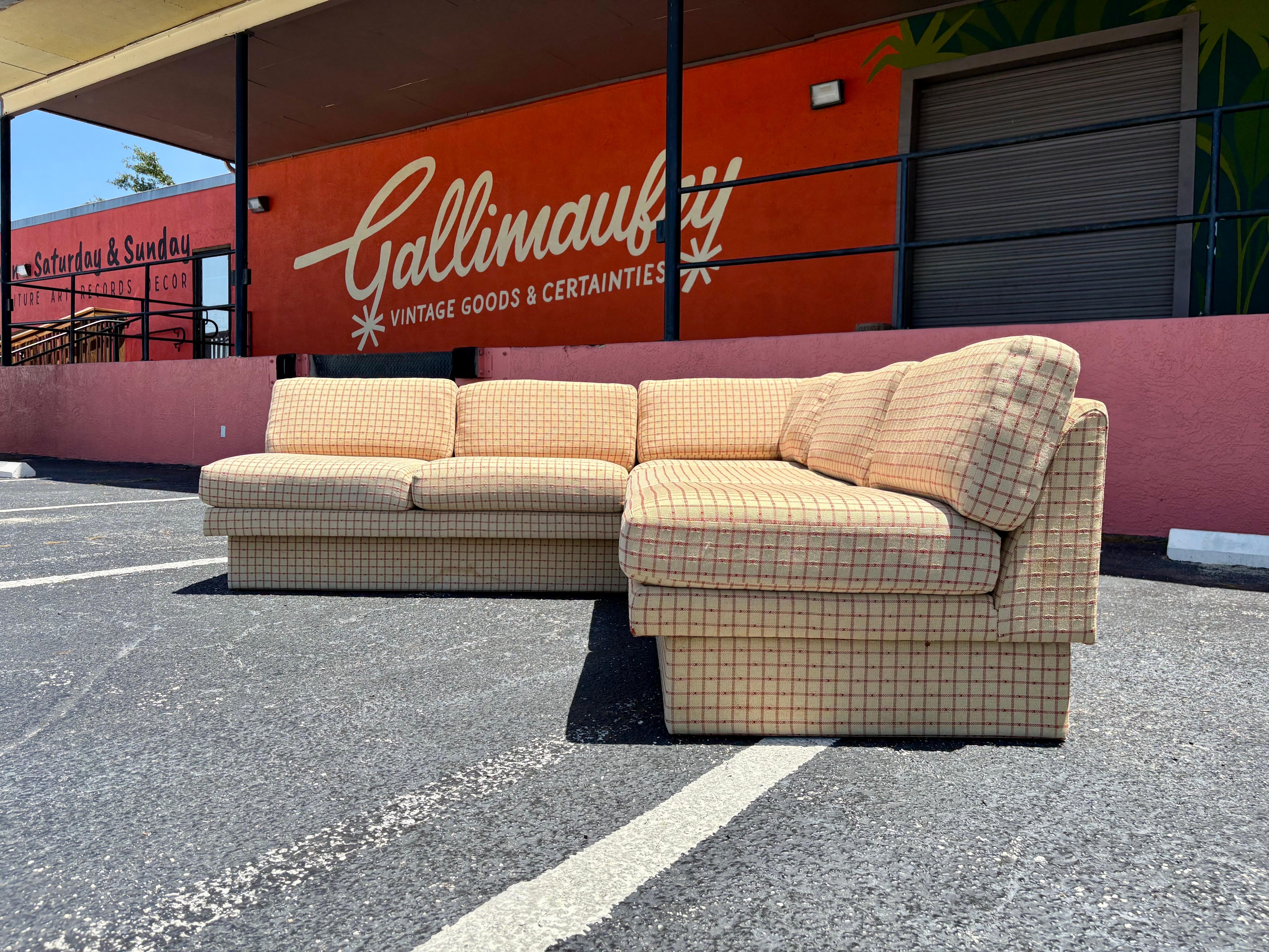 Vintage two piece Sectional Sofa custom ordered by previous owners from Galloways Tampa in 1980. Very Mid Century to Post Modern shape and profile done in off white and red checked plaid fabric. In overall good original vintage condition with some