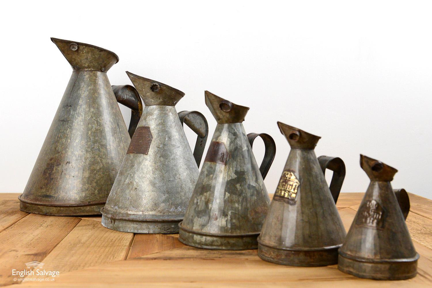 Galvanised oil jugs with handles salvaged from India. Details below. Few small dings and bumps to all.