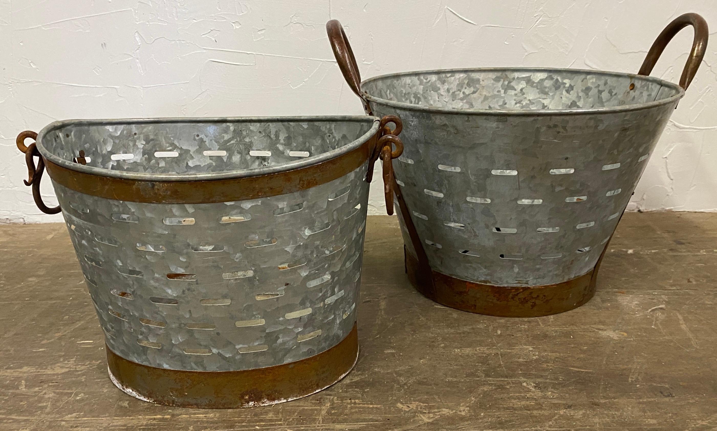 Vintage galvanized olive bucket or basket.  Use it for a waste basket, storage baskets, planters or a catch all.  Basket has wonderful copper tone bands giving it added interest and more decorative.   A second similar basket is available.  See photo