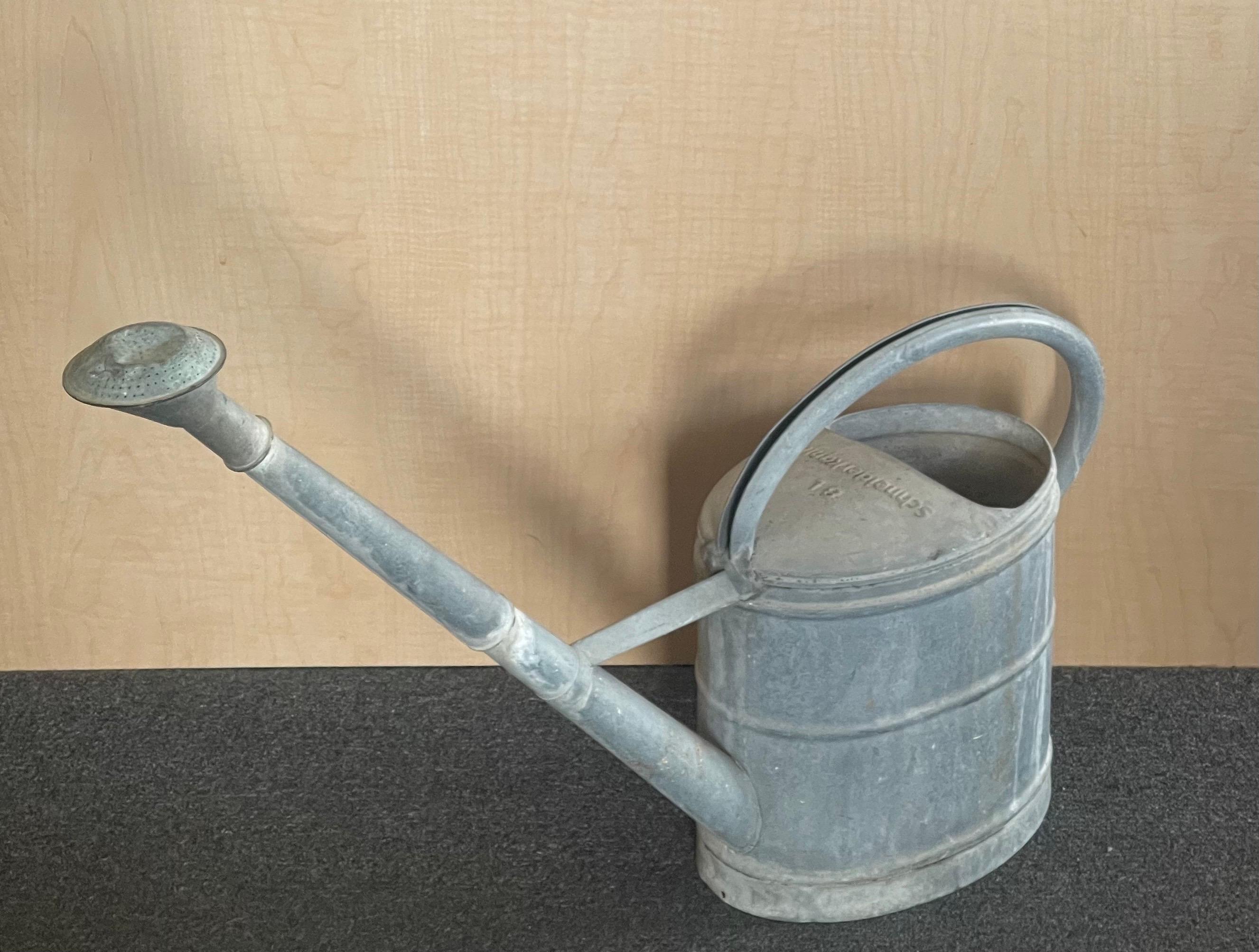 A charming vintage galvanized steel watering can by Schneiderkanne of Germany, circa 1940s. The can is in good vintage condition and measures 31