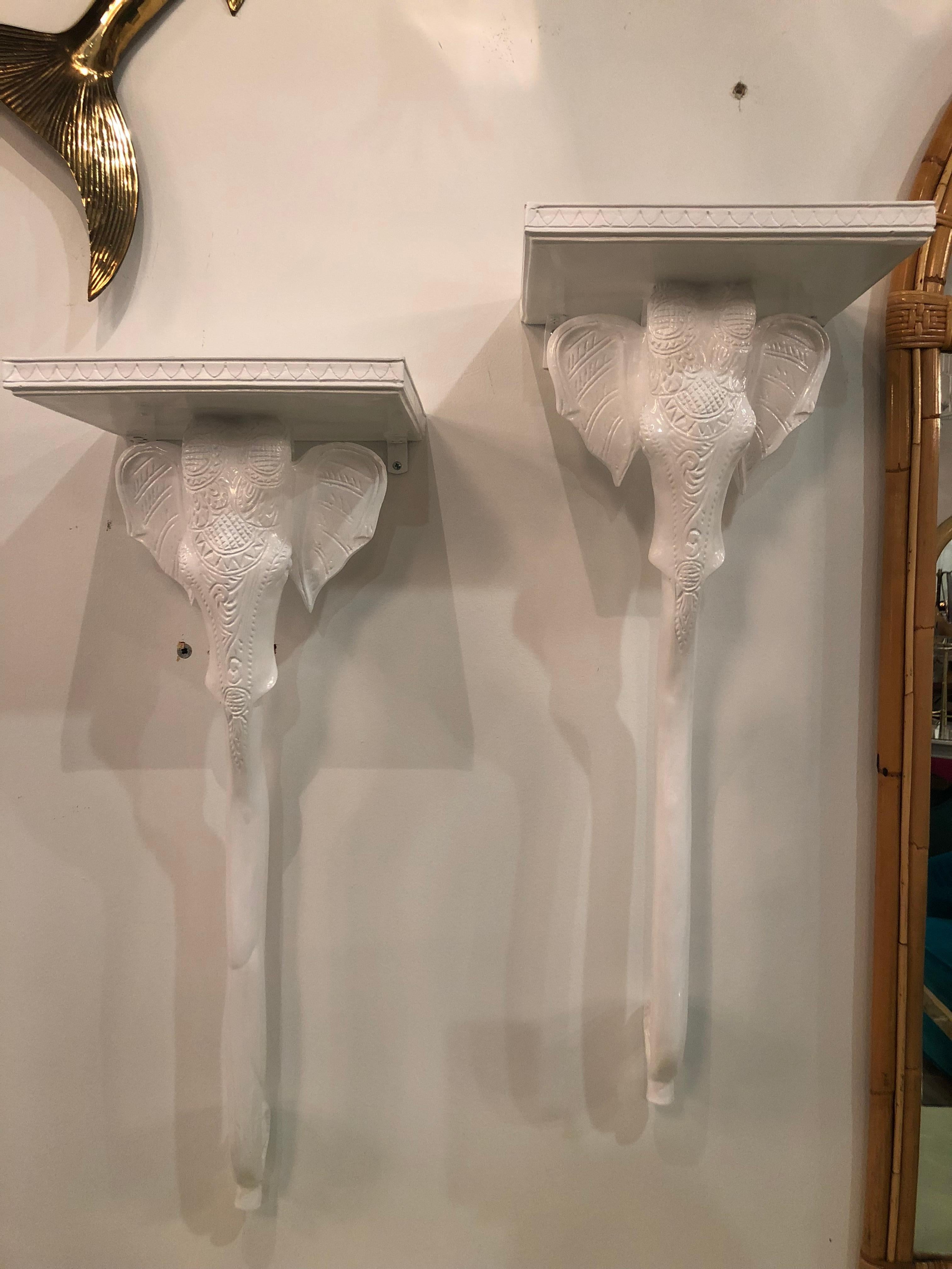 Vintage pair of Gampel Stoll elephant wall sconces. Newly lacquered in a white gloss. Ready to hang on your wall. Perfect shelf on top for small collectables.

 