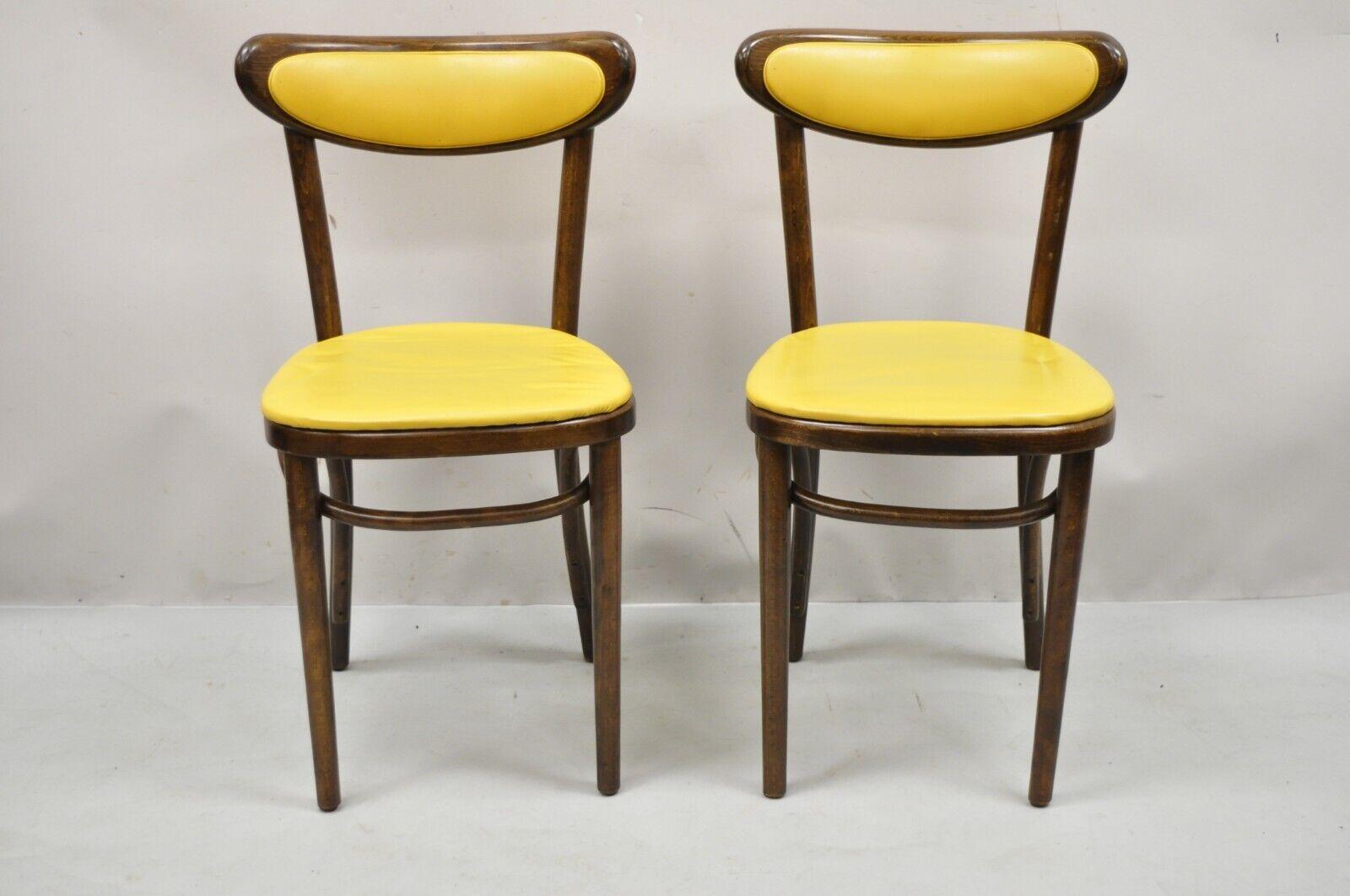 Vintage GAR Products yellow bentwood ice cream parlor side chairs - a Pair. Item features a bentwood frame, yellow vinyl upholstery, original label, very nice vintage pair, great style and form. Circa Mid 20th Century. Measurements: 32
