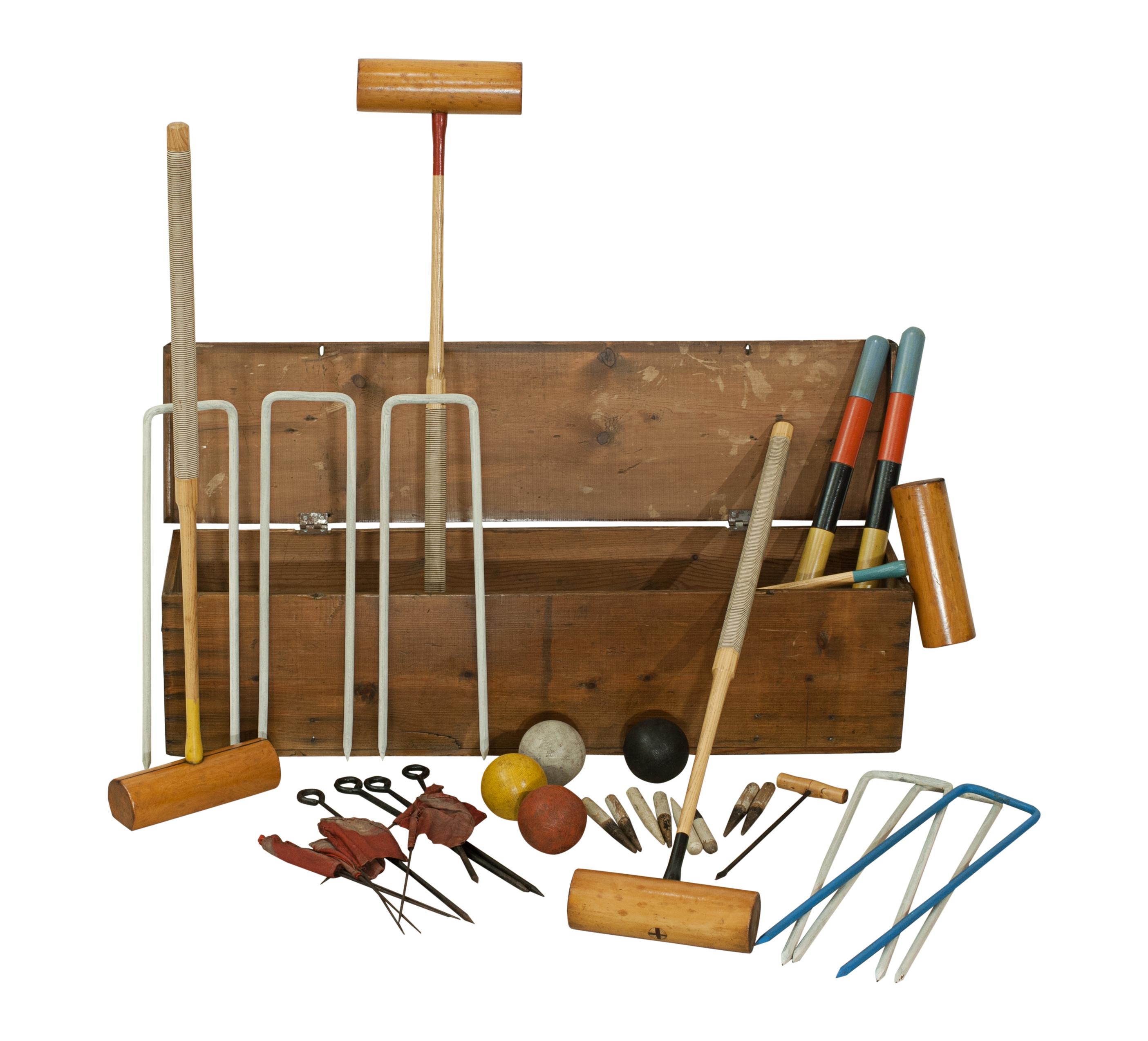 A good croquet set in polished pine box with two carry handles. The set comes with four box wood croquet mallets with octagonal ash handles with cord grip (which helps a player 'feel' the alignment of the mallet in play). To complete the set there